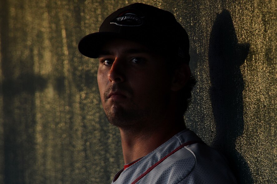A baseball player with the Greenville Drive looks out towards the outfield during a military appreciation baseball game between the Charleston RiverDogs and the Greenville Drive at Joseph P. Riley Jr. Ballpark, Charleston, S.C., May 14, 2015. The game ended with the Drive winning 4-2. (U.S. Air Force photo by Airman 1st Class Michael Cossaboom/Released)