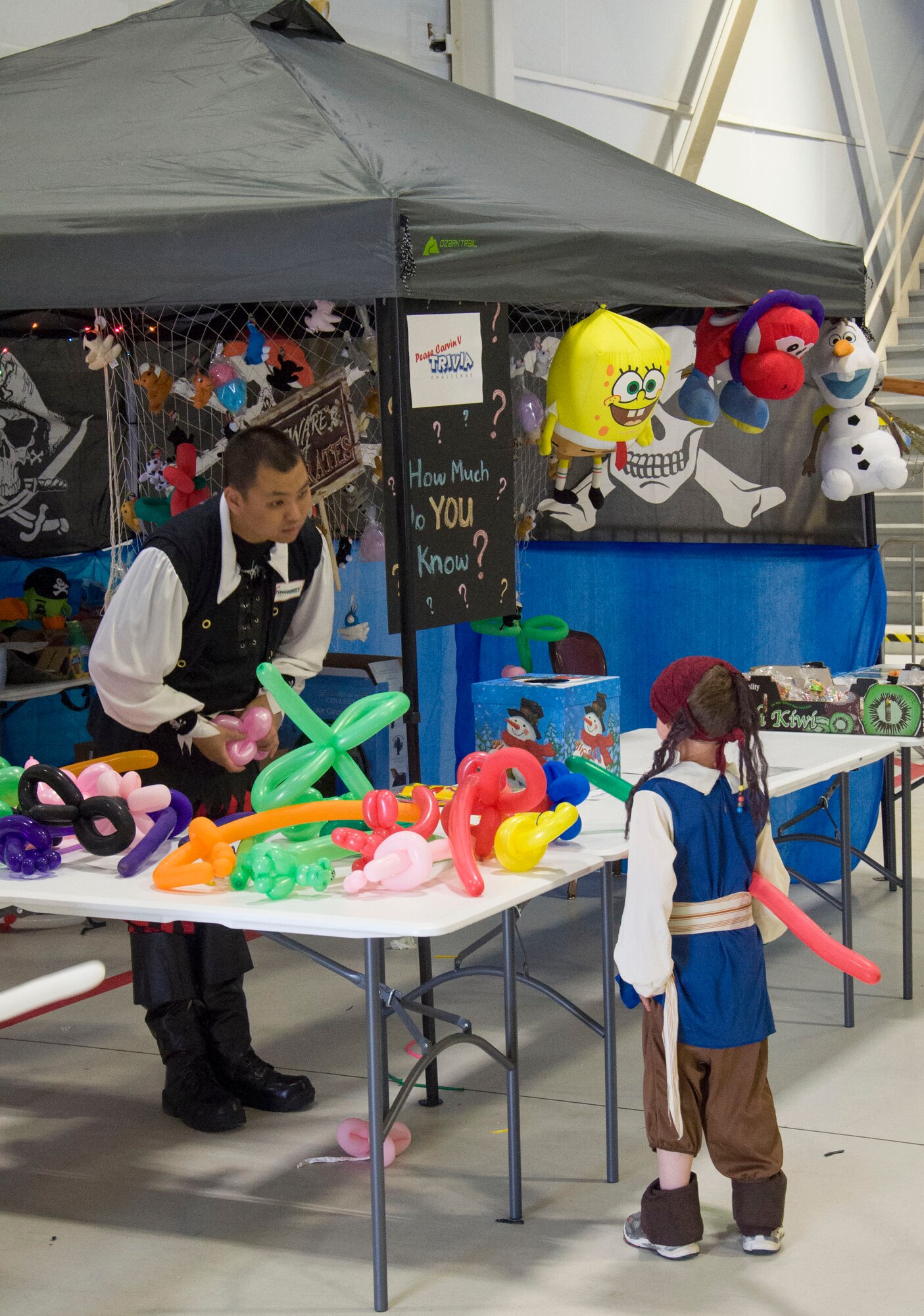 A member of the 428th Fighter Squadron takes a request for a balloon animal at the Peace Carvin V celebration at Mountain Home Air Force Base, Idaho, May 15, 2015. The celebration had numerous booths and games for children of the Gunfighter community. (U.S. Air Force photo by 2nd LT. Kippun D. Sumner/RELEASED)

