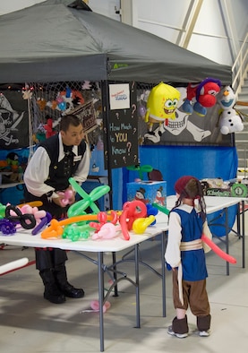 A member of the 428th Fighter Squadron takes a request for a balloon animal at the Peace Carvin V celebration at Mountain Home Air Force Base, Idaho, May 15, 2015. The celebration had numerous booths and games for children of the Gunfighter community. (U.S. Air Force photo by 2nd LT. Kippun D. Sumner/RELEASED)

