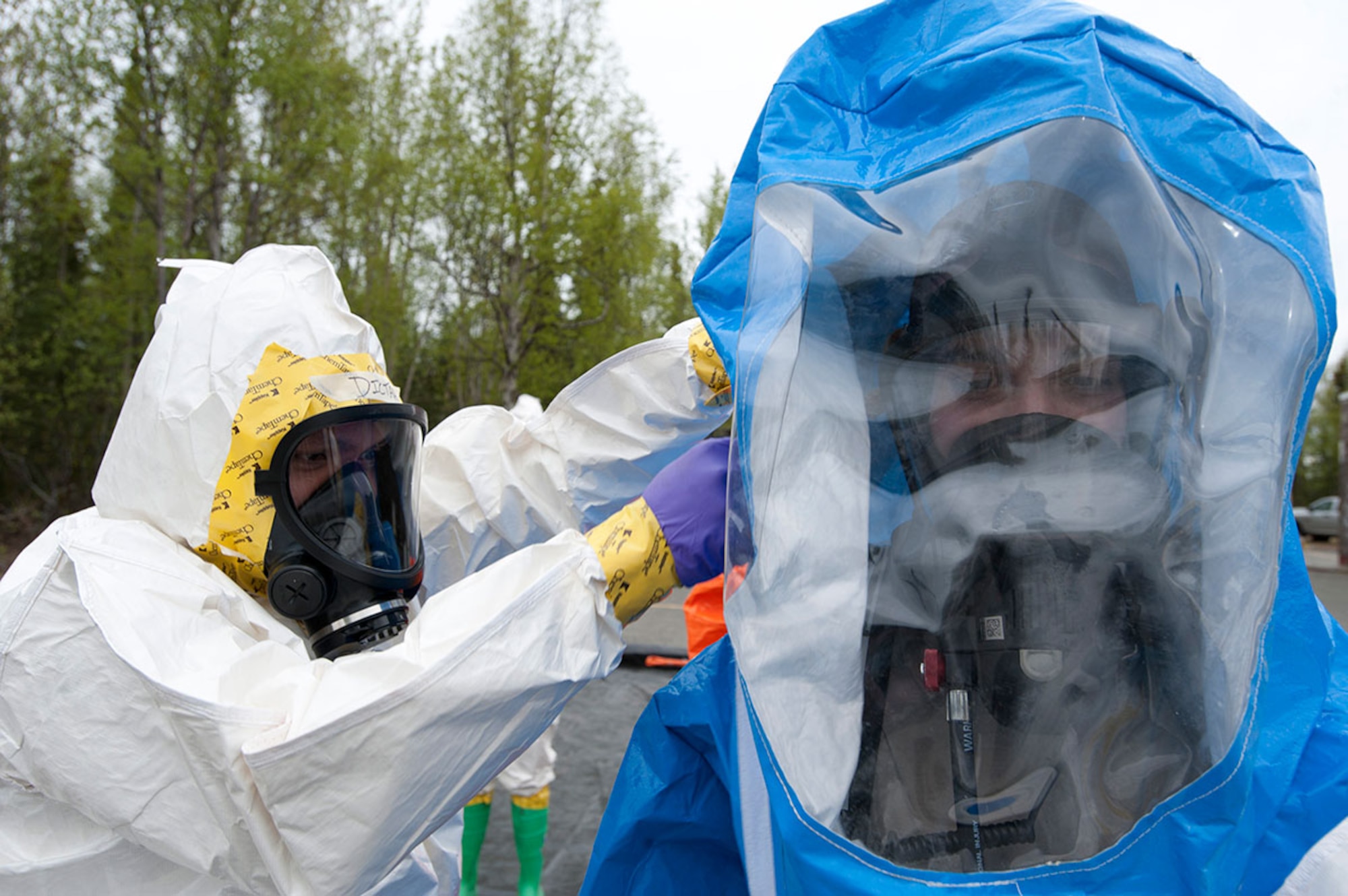 Air Force 1st Lt. Philicia Geiser simulates decontaminating Senior Airman Matthew Castellanos during Integrated Base Emergency Response Training on Joint Base Elmendorf-Richardson, Alaska, May 14, 2015. Geiser is a bio-environmental engineer and a native of Falcon, Colo. Castellanos is a 773d Civil Engineer Squadron bio-environmental engineering technician and a native of Wescovena, Calif. (U.S. Air Force photo/Tech. Sgt. Robert Barnett)