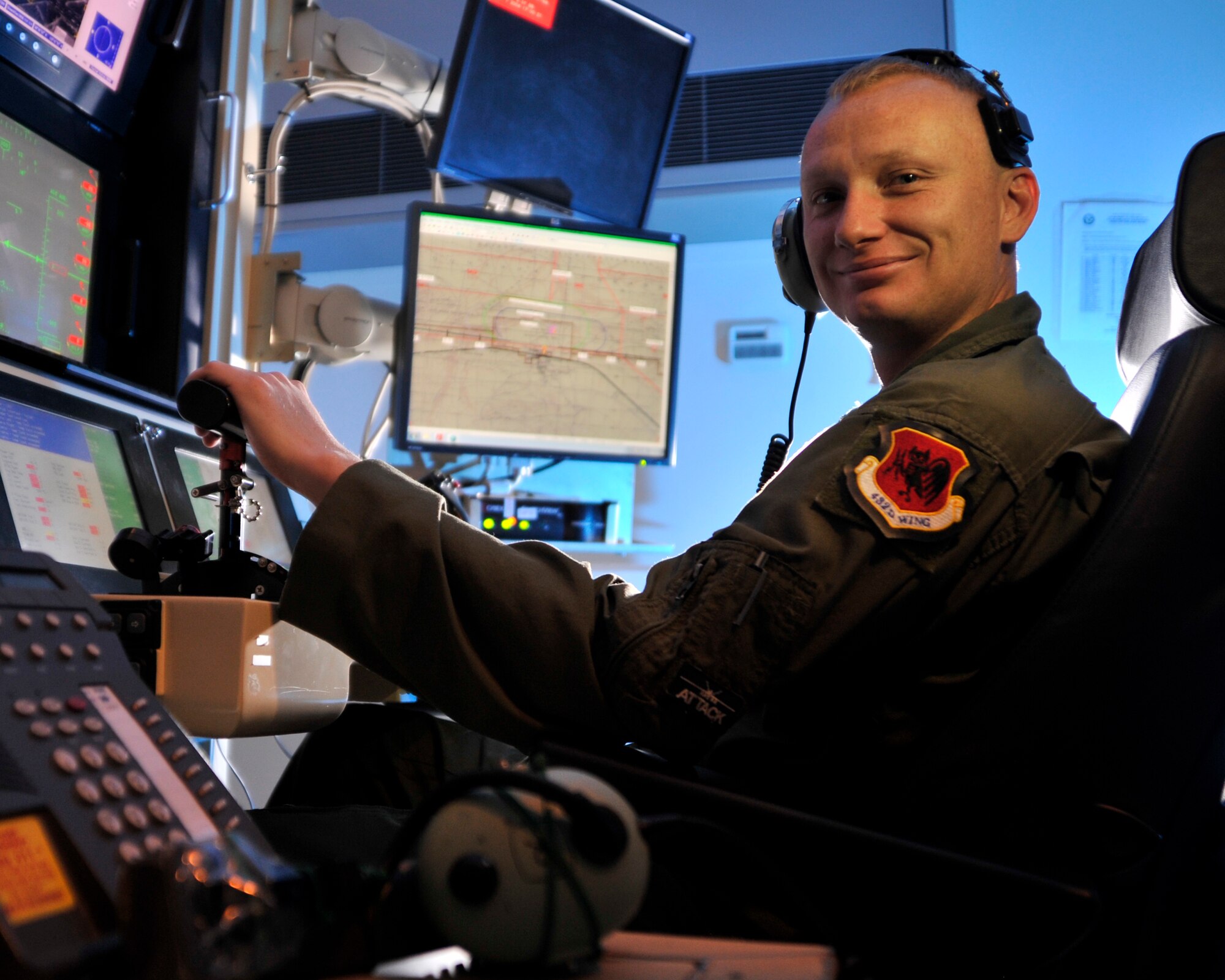 SSgt. Marion, 42nd Attack Squadron sensor operator, poses for a photo March 24, 2015, at Creech Air Force Base, Nevada. Marion has been recognized by top Air Force leadership for constructing a device dubbed Frankenphone 3.5 Ultra High Definition, which simplifies life in the ground control station while flying remotely piloted aircraft allowing operators seamlessly execute the mission and save lives. (U.S. Air Force photo by Airman 1st Class Christian Clausen/Released)