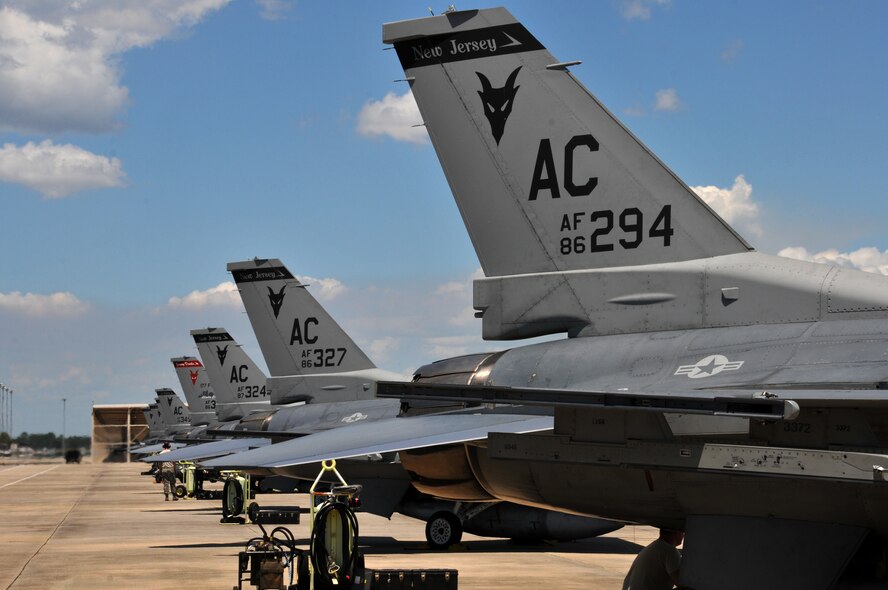 U.S. Air Force F-16 Fighting Falcons from the 177th Fighter Wing of the New Jersey Air National Guard are chocked on the ramp prior to flight at Tyndall Air Force Base, Fla., May 6, 2015. Fighter pilots, maintainers and support staff from the unit deployed to Tyndall for Combat Archer training with the 53rd Weapons Evaluations Group, testing weapons systems, from start to finish, in the air-to-air realm. (U.S. Air National Guard photo by Master Sgt. Andrew J. Moseley/Released)