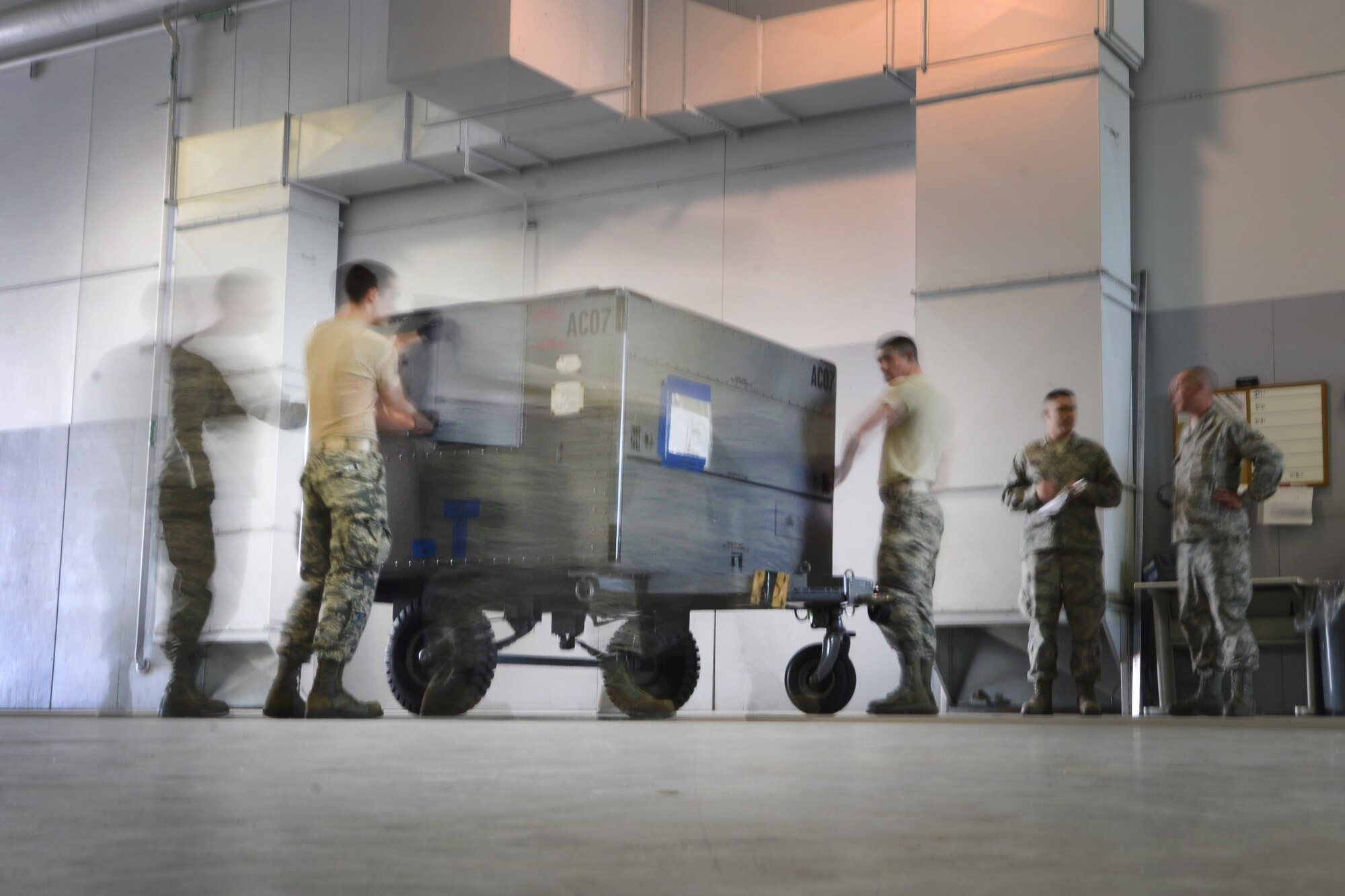 U.S. Air Force Airmen assigned to the 354th and 773rd Logistics Readiness Squadrons, perform a pre-joint inspection on a cargo load May 14, 2015, during RED FLAG-Alaska (RF-A) 15-2 at Eielson Air Force Base, Alaska. The section processed more than 40 short tons of cargo for the redeployment of RF-A participants. (U.S. Air Force photo by Senior Airman Ashley Nicole Taylor/Released)