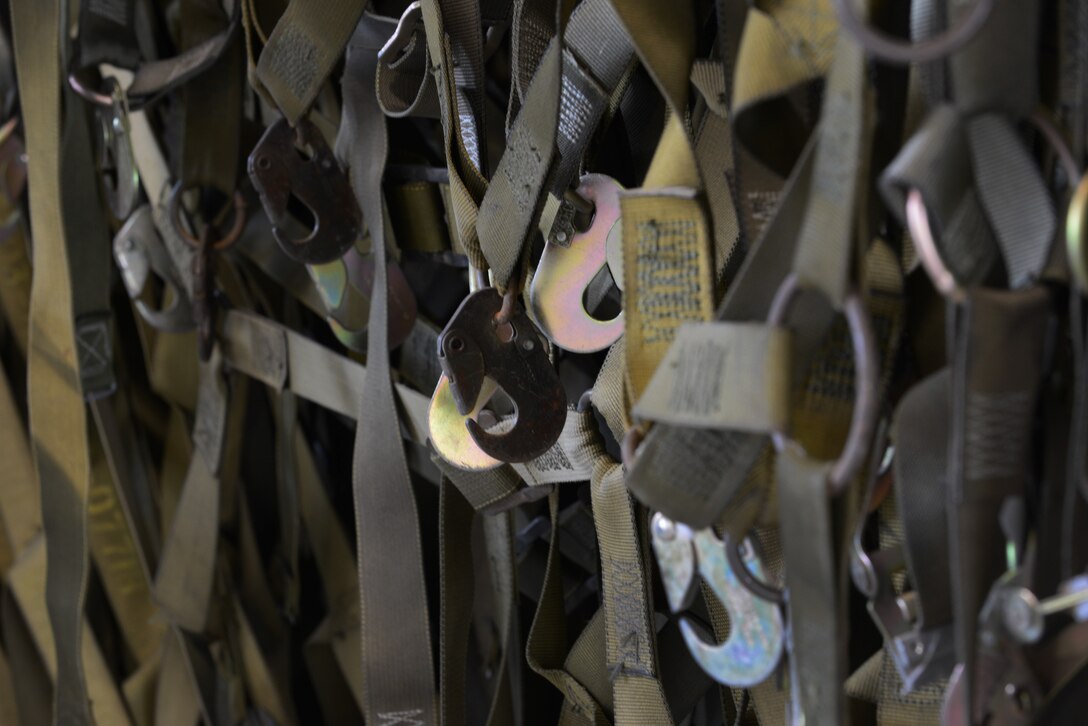 Cargo nets hang in the bay area of the Stevens Joint Mobility Complex on May 14, 2015, during RED FLAG-Alaska 15-2 at Eielson Air Force Base, Alaska. It is critical to restrain cargo within military aircraft because a moving load can put both the crew and aircraft at risk. (U.S. Air Force photo by Senior Airman Ashley Nicole Taylor/Released)