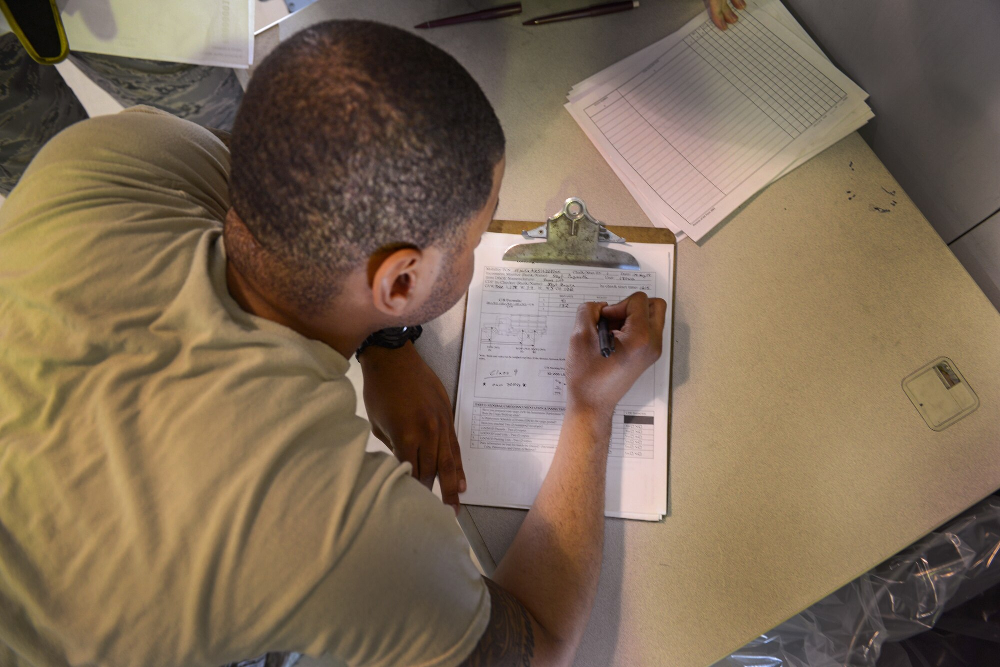 U.S. Air Force Airman 1st Class Joshua Bransom, a 354th Logistics Readiness Squadron traffic management journeyman, records the weight and measurements of a cargo load May 14, 2015, during RED FLAG-Alaska (RF-A) 15-2 at Eielson Air Force Base, Alaska. Bransom was one out of a handful of Airmen who assisted the air terminal operations section to ensure all cargo was inspected safely and swiftly. (U.S. Air Force photo by Senior Airman Ashley Nicole Taylor/Released)