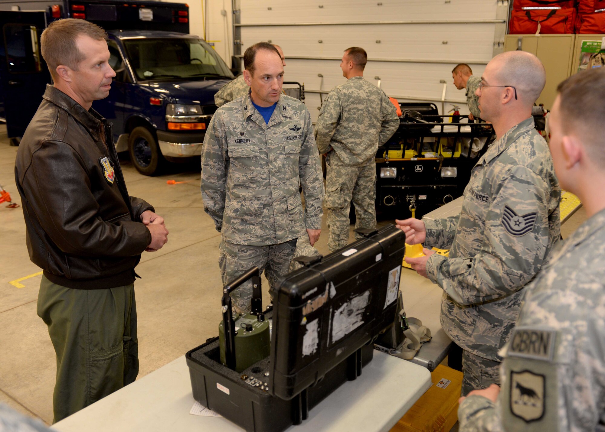 Col. Kevin Kennedy, 28th Bomb Wing commander, and Col. Ty Neuman, 28th BW vice commander, speak with South Dakota Air National Guard Tech. Sgt. Dustin Clement, 82nd Civil Support Team survey team chief, about equipment the 82nd CST uses to identify chemical threats at Ellsworth Air Force Base, S.D., May 15, 2015. The CST supports civil authorities during domestic chemical, biological, radiological, nuclear, and high yield explosive incidents in order to help save lives, prevent human suffering and mitigate property damage. (U.S Air Force photo by Airman 1st Class Rebecca Imwalle / Released)