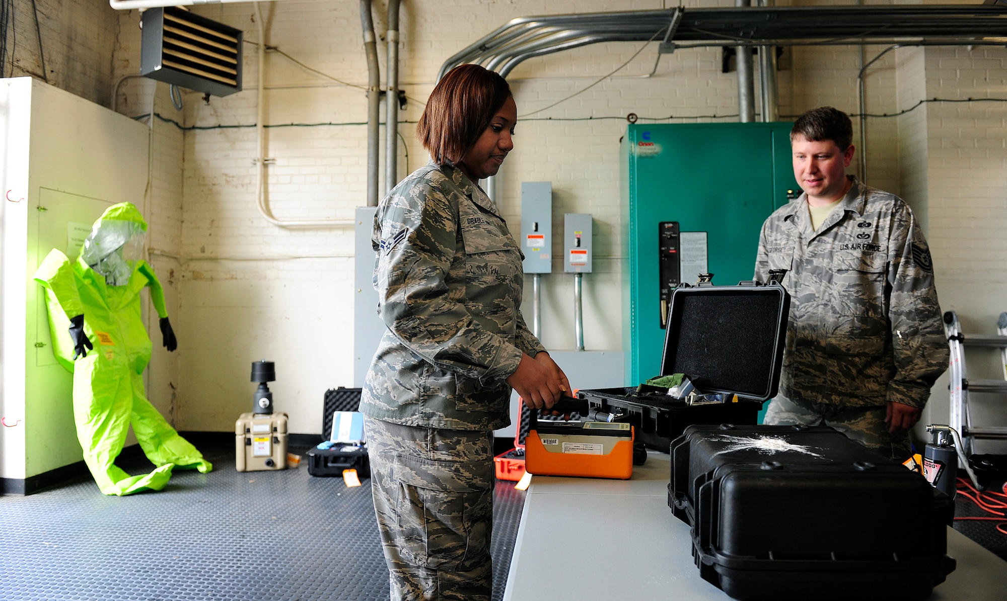 Airman 1st Class Loreal Grable-Hairston, 94th Civil Engineer Squadron emergency apprentice uses equipment to simulate detecting radiation during training at Scott Air Force Base, Illinois, May 18, 2015. Grable-Hairston is one of two Airmen here temporary duty from Dobbins Air Reserve Base for training to complete upgrade training. 
