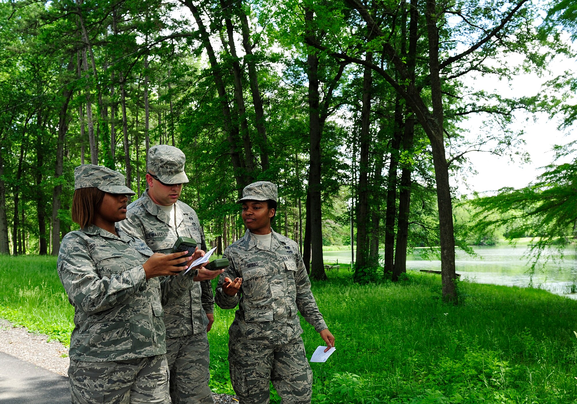 Airman 1st Class Shameika Spinks, Tech. Sgt. Timothy George, and A1C Loreal Grable-Hairston, emergency managers from the 94th Civil Engineer Squadron use a Defense Advanced GPS receiver to map GPS points during training at Scott Air Force Base, Illinois, May 18, 2015. The Airmen are here from Dobbins Air Reserve Base to complete upgrade training with the help of the 375th CES emergency management flight. (U.S. Air Force photos by Staff Sgt. Stephenie Wade)