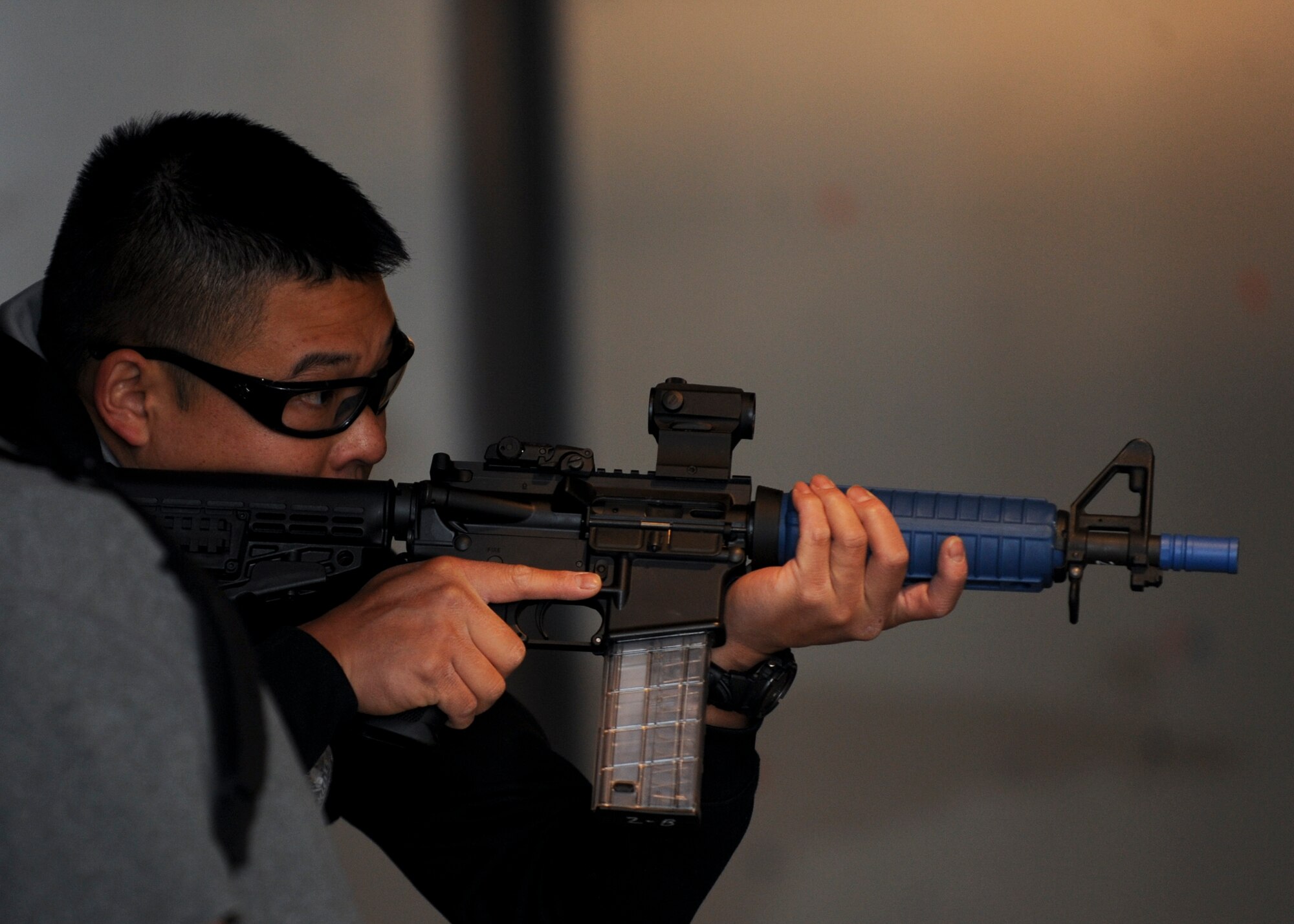 Tyrone Lee, Sturgis Police Department patrol officer, prepares to move during a shoot-house competition at Ellsworth Air Force Base, S.D., May 12, 2015. As part of Police Week, the competition promoted camaraderie between military and local law enforcement agencies, and was one of a variety of events to include a retreat ceremony, weapons and vehicles display and a softball tournament, all of which took place May 11 - 16. (U.S. Air Force photo by Senior Airman Anania Tekurio/Released)