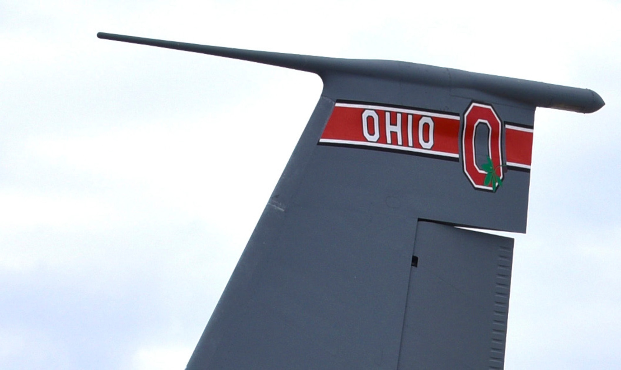 A KC-135 Stratotanker at the 121st Air Refueling Wing, Rickenbacker Air National Guard Base, Ohio, receives new artwork, to include a block “O” on the tail flash, racing stripes down the sides, “eyebrow” painting over the pilot and co-pilot’s windows, and nose art. Over the course of their normal maintenance schedule, the rest of the 121 ARW aircraft will receive the new artwork as well. (U.S. Air National Guard photo by Senior Airman Wendy Kuhn/Released)