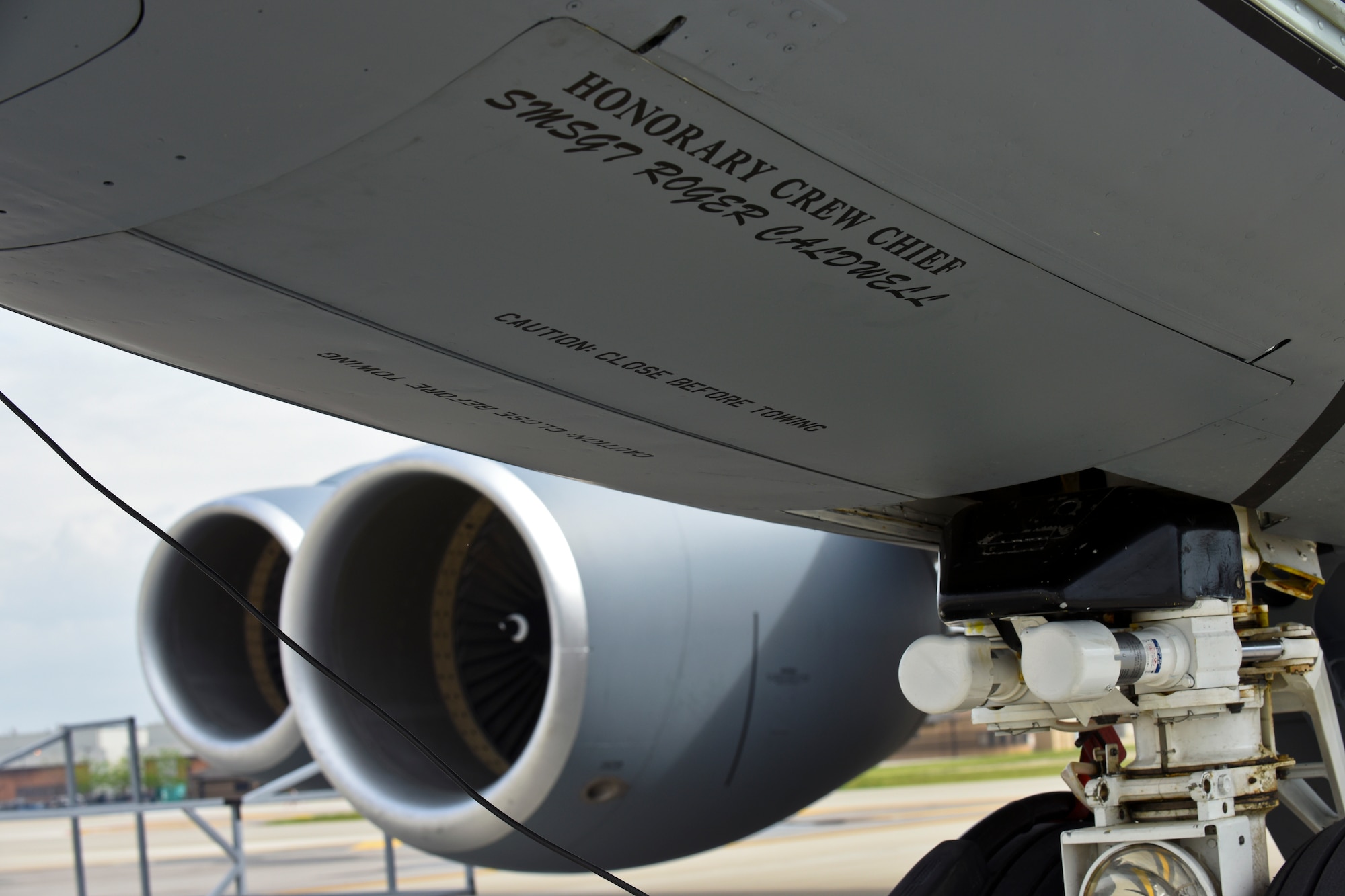 A KC-135 Stratotanker at the 121st Air Refueling Wing, Rickenbacker Air National Guard Base, Ohio, receives new artwork, to include a block “O” on the tail flash, racing stripes down the sides, “eyebrow” painting over the pilot and co-pilot’s windows, and nose art. Over the course of their normal maintenance schedule, the rest of the 121 ARW aircraft will receive the new artwork as well. (U.S. Air National Guard photo by Senior Airman Wendy Kuhn/Released)