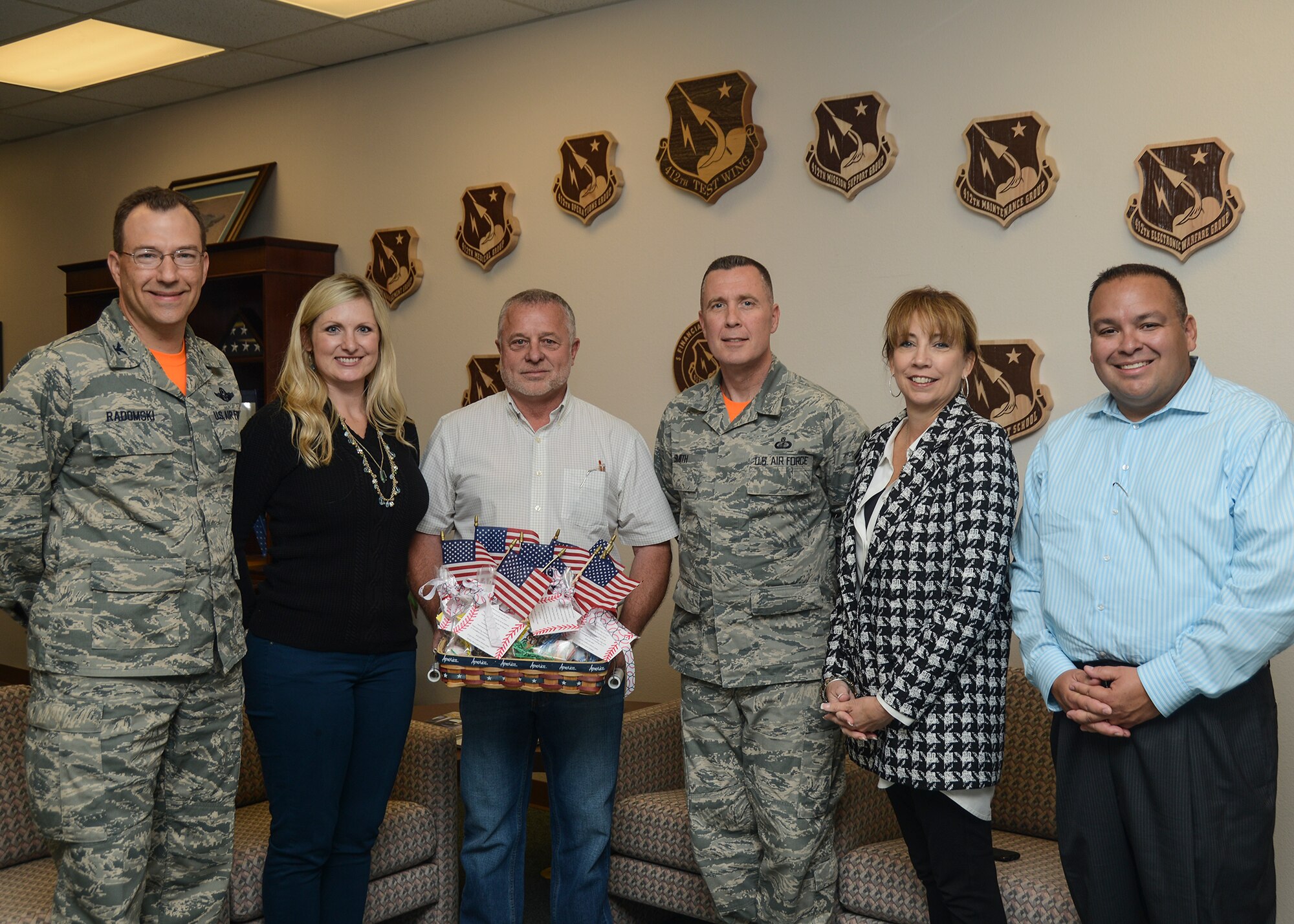 Left to Right: Col. David Radomski, 412th Test Wing vice commander, Allison Hastings, Donald Collins, Chief Master Sgt. David Smith, 412th TW command chief, Carole Sarian and Jason Siegen. (U.S. Air Force photo by Rebecca Amber)  