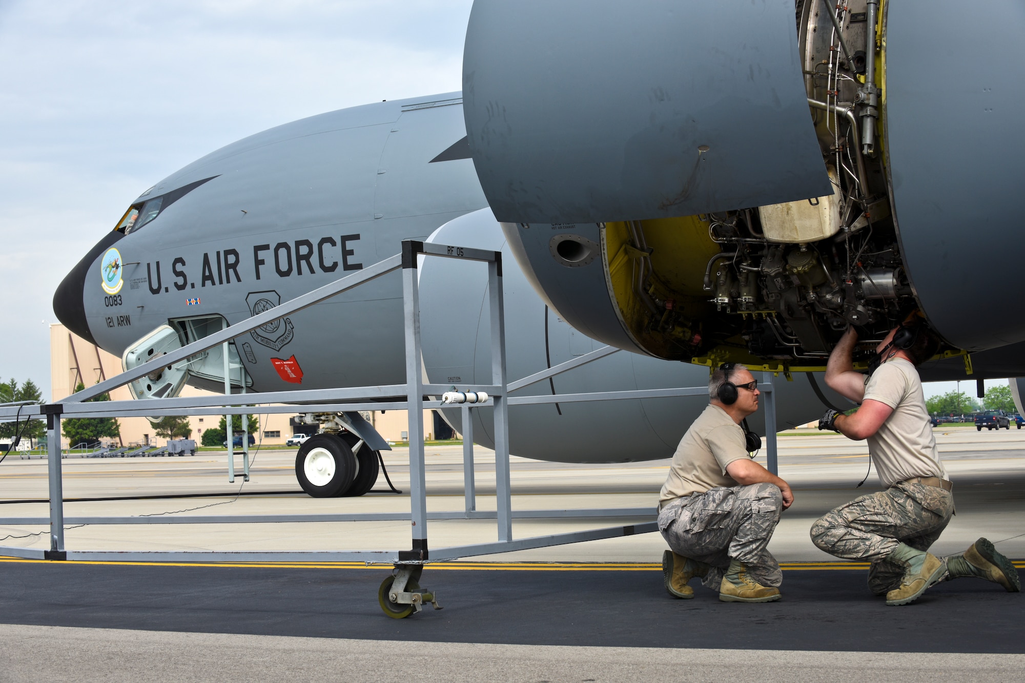 A KC-135 Stratotanker at the 121st Air Refueling Wing, Rickenbacker Air National Guard Base, Ohio, receives new artwork, to include a block “O” on the tail flash, racing stripes down the sides, “eyebrow” painting over the pilot and co-pilot’s windows, and nose art. Over the course of their normal maintenance schedule, the rest of the 121 ARW aircraft will receive the new artwork as well. (U.S. Air National Guard photo by Senior Airman Wendy Kuhn/Released)