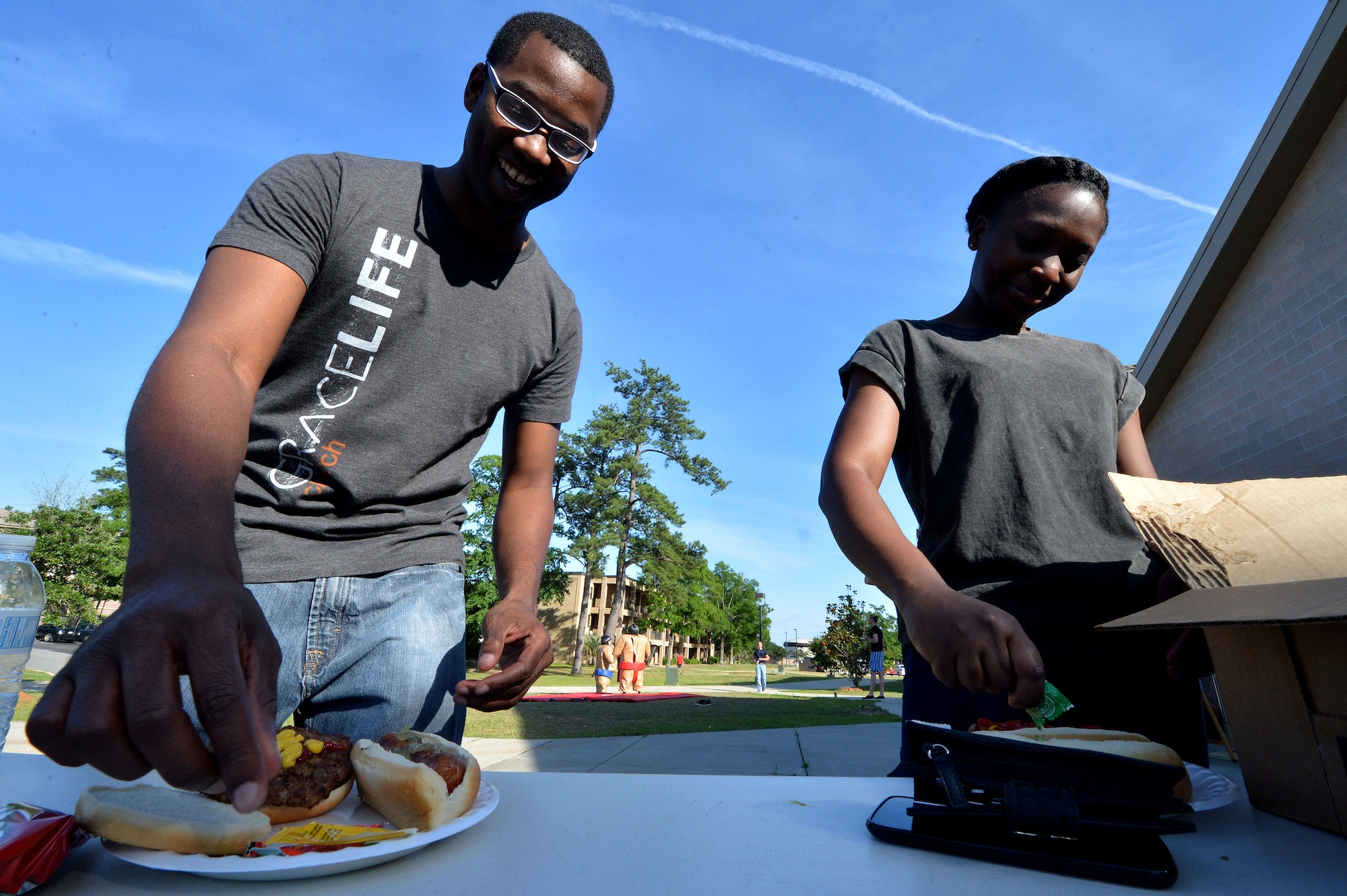 Airmen assigned to the 20th Fighter Wing put together hamburgers during a base-wide block party at Shaw Air Force Base, S.C., May 17, 2015. The first ever base wide block party was hosted by the 20th FW chapel team at seven locations across base. (U.S. Air Force photo by Airman 1st Class Michael Cossaboom/Released)