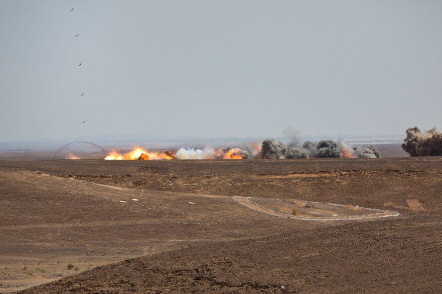 Guided Bomb Unit-38's impact the ground after being dropped from a U.S. Air Force B-52H Stratofortress during a combined live fire demonstration during Exercise Eager Lion in Wadi Shadiya, Jordan, May 18, 2015. Eager Lion is a recurring, multinational exercise designed to strengthen military-to-military relationships, increase interoperability between partner nations, and enhance regional security and stability. (U.S. Marine Corps photo by Cpl. Sean Searfus CE MARFOR CENTCOM FWD COMCAM/ Released)