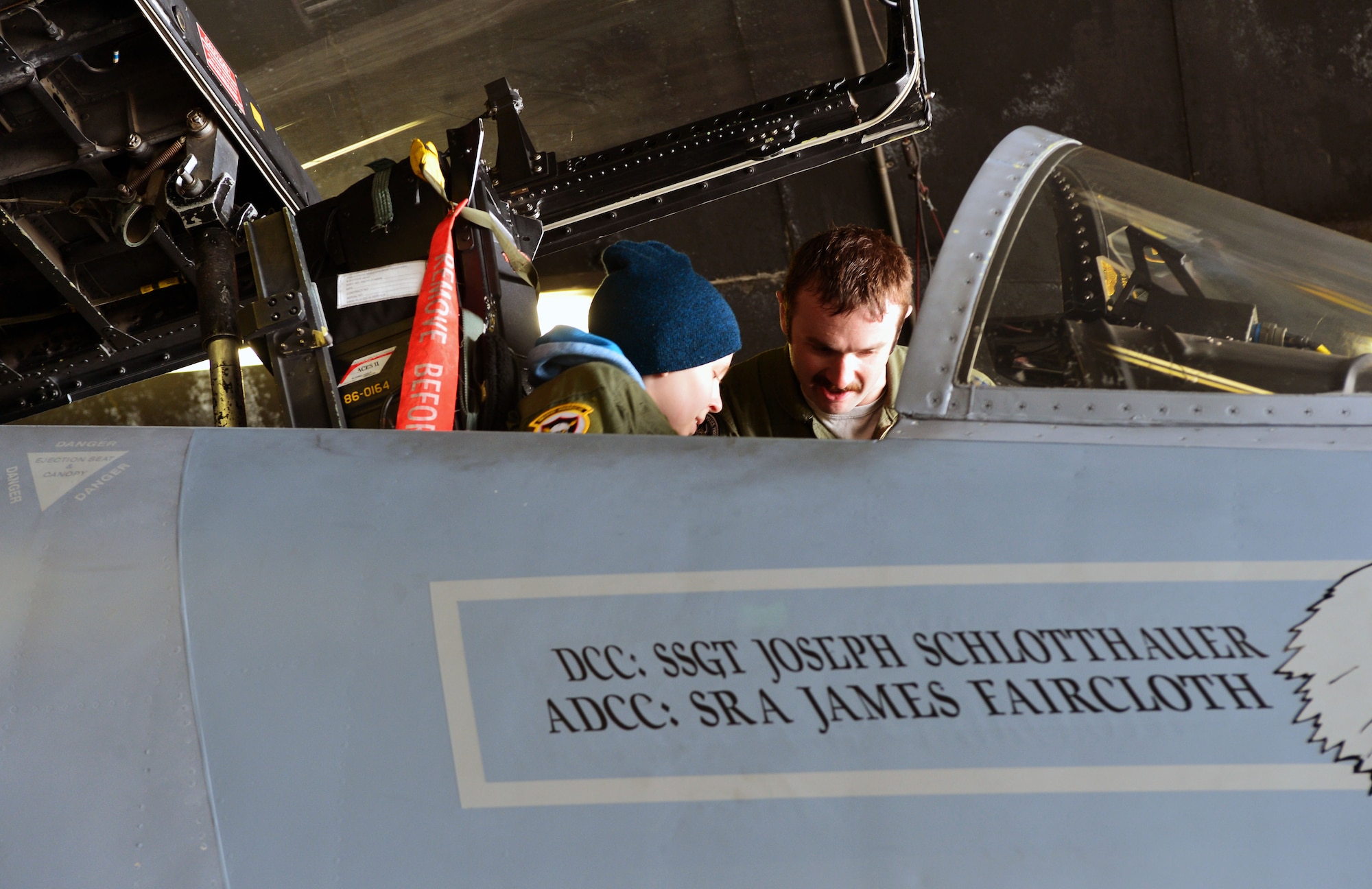 U.S. Air Force Captain Jason Ford, 871st Air Expeditionary Squadron F-15C Eagle fighter aircraft pilot, shows Gunnar Guðlaugsson the cockpit of an F-15C Eagle fighter aircraft during the Pilot for a Day program at Keflavik International Airport, Iceland, May 13, 2015.The final part of the program included a tour of one of the F-15Cs stationed at Keflavik for Icelandic Air Surveillance and Policing. (U.S. Air Force photo by 2nd Lt. Meredith Mulvihill/Released)