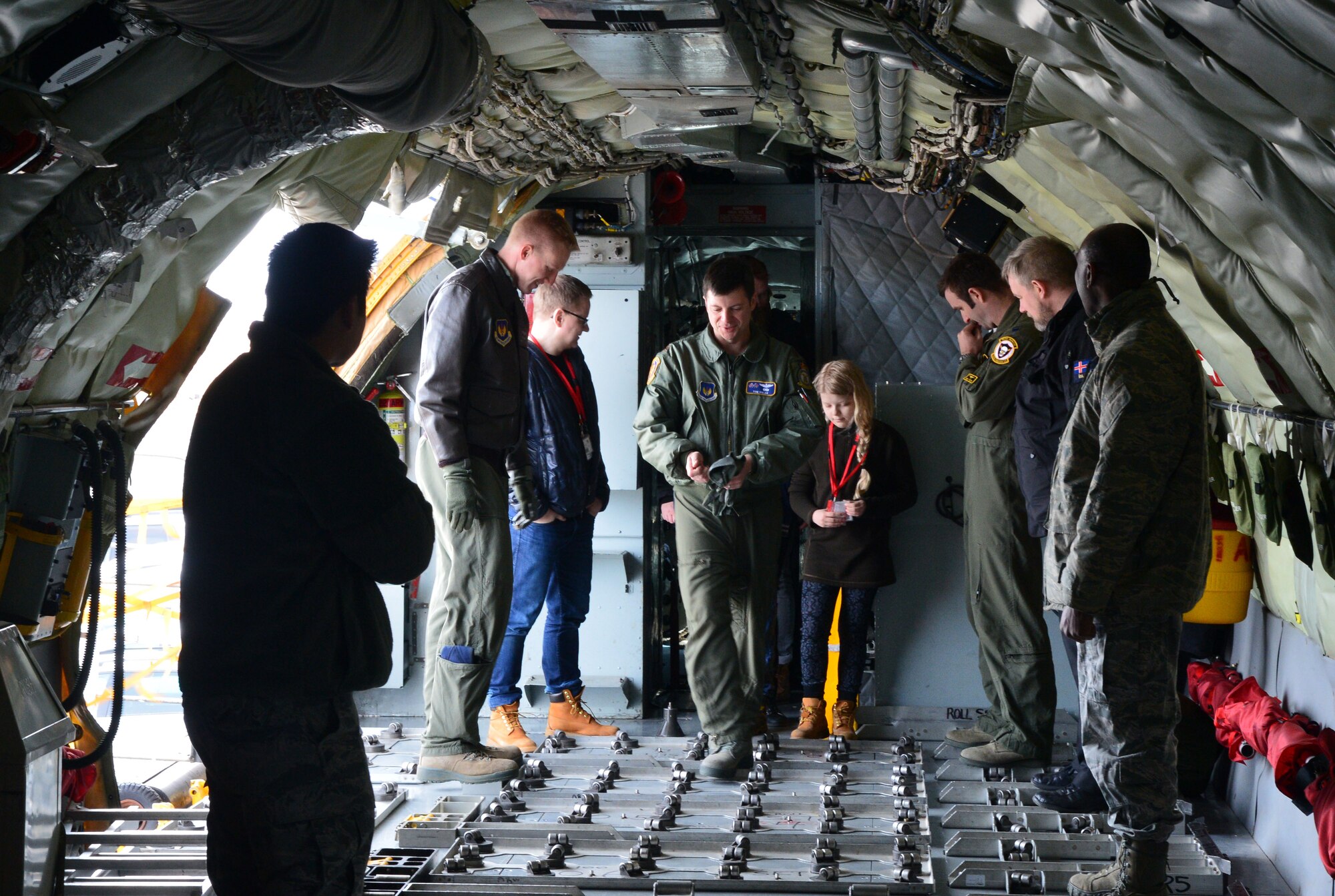 U.S. Airmen from the 871st Air Expeditionary Squadron give Gunnar Guðlaugsson, Arna Tryggvadóttir and their families a tour of a KC-135 Stratotanker aircraft during the Pilot for a Day program at Keflavik International Airport, Iceland, May 13, 2015. The program allowed two terminally ill Icelandic children to tour operations at Keflavik and experience a day in the life of a U.S. Air Force pilot.(U.S. Air Force photo by 2nd Lt. Meredith Mulvihill/Released)