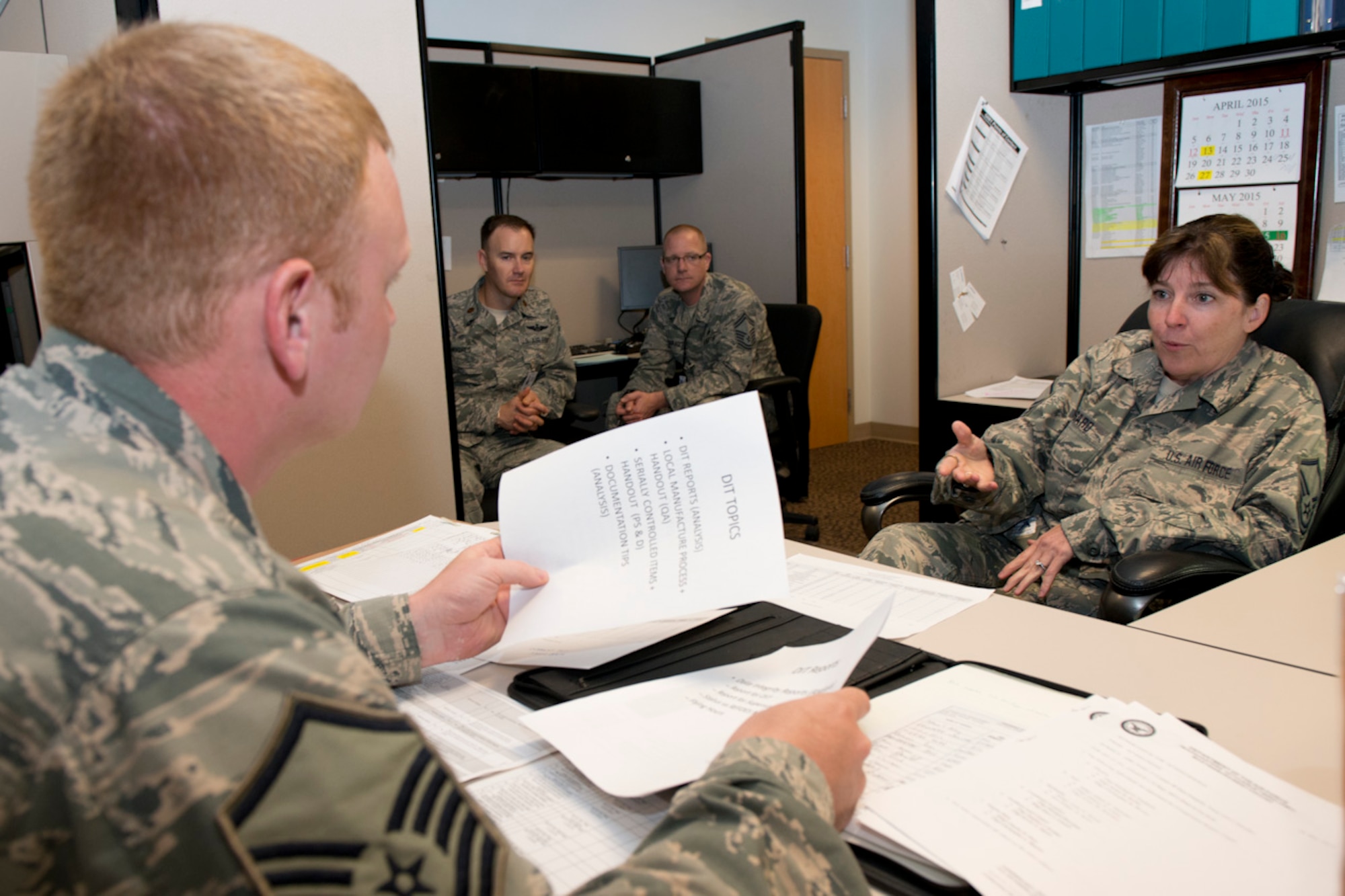 Master Sgt. Roberta Gossard, a maintenance management analyst with the 167th Airlift Wing’s Maintenance Operations Flight, explains the basics of the data integrity program that is managed by maintenance analysts to Master Sgt. Justin Walther, a member of the Wing Inspection Team. As Walther interviewed Gossard during the MOF inspection, Maj. Jason G. Hughes and Senior Master Sgt. John P. Pflugradt, left to right in background, observe. Hughes and Pflugradt are members of the Air Mobility Command’s Inspector General’s Inspections Division. This is the first time an AMC’s IG team has paid a visit to the Martinsburg wing and observed a unit inspection since the implementation here of the Air Force Inspection System (AFIS) construct. (Air National Guard photo by Staff Sgt. Sherree Grebenstein/Released)