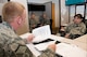 Master Sgt. Roberta Gossard, a maintenance management analyst with the 167th Airlift Wing’s Maintenance Operations Flight, explains the basics of the data integrity program that is managed by maintenance analysts to Master Sgt. Justin Walther, a member of the Wing Inspection Team. As Walther interviewed Gossard during the MOF inspection, Maj. Jason G. Hughes and Senior Master Sgt. John P. Pflugradt, left to right in background, observe. Hughes and Pflugradt are members of the Air Mobility Command’s Inspector General’s Inspections Division. This is the first time an AMC’s IG team has paid a visit to the Martinsburg wing and observed a unit inspection since the implementation here of the Air Force Inspection System (AFIS) construct. (Air National Guard photo by Staff Sgt. Sherree Grebenstein/Released)