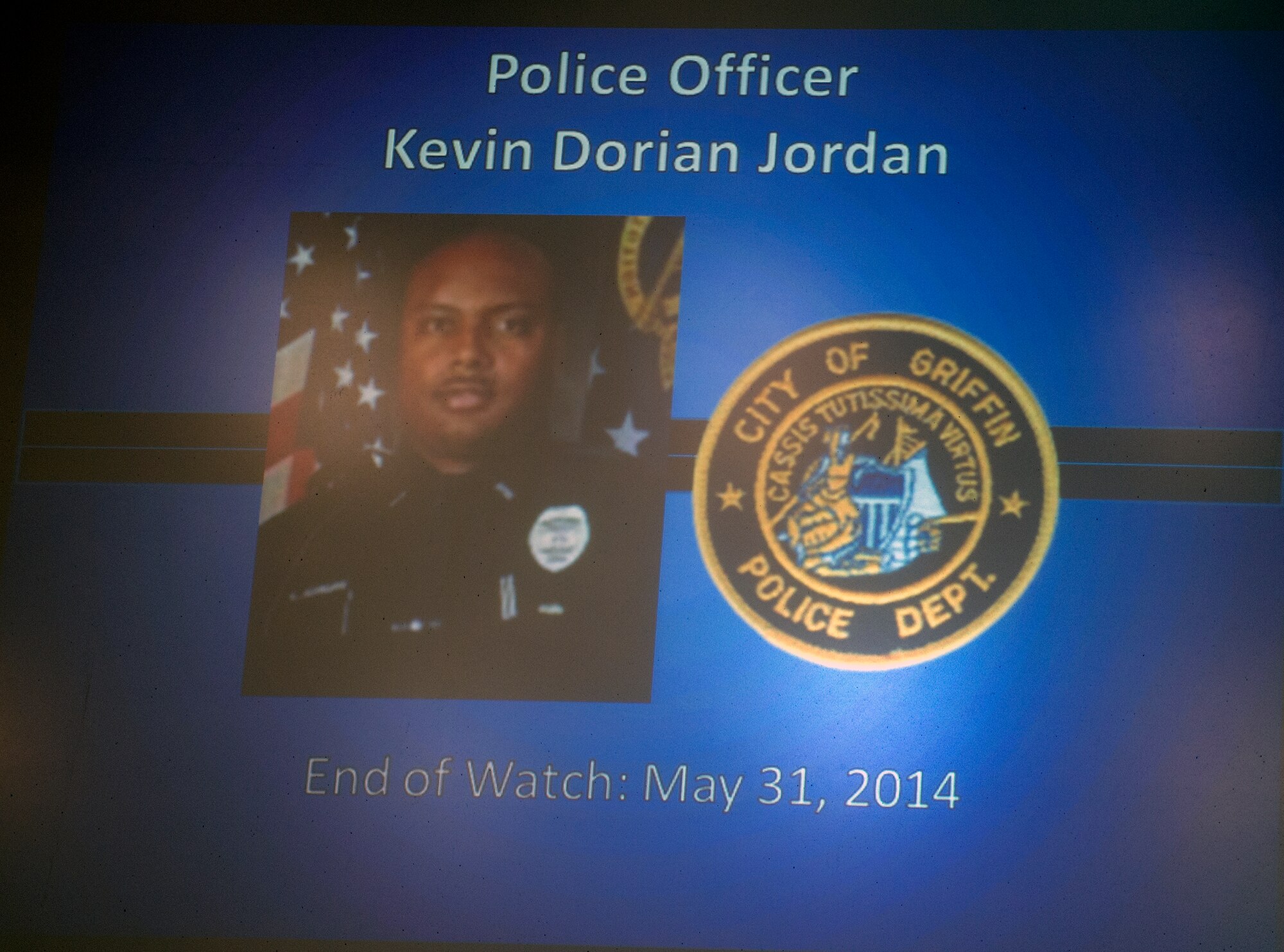 A memory slideshow was shown before the conclusion of the 2015 National Police Week Memorial Ceremony May 15, 2015, at Moody Air Force Base, Ga. Attendees reflected and gave their respects to fallen law enforcement officials and Airmen.  (U.S. Air Force photo by Airman Greg Nash/Released)