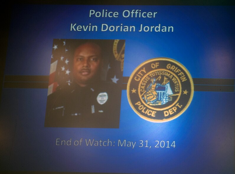 A memory slideshow was shown before the conclusion of the 2015 National Police Week Memorial Ceremony May 15, 2015, at Moody Air Force Base, Ga. Attendees reflected and gave their respects to fallen law enforcement officials and Airmen.  (U.S. Air Force photo by Airman Greg Nash/Released)