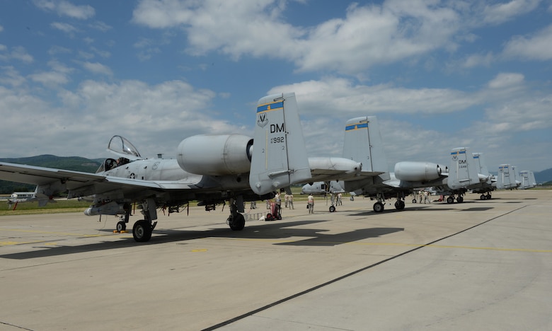 Four U.S. Air Force A-10 Thunderbolt II aircraft assigned to the 354th Expeditionary Fighter Squadron sit on a ramp during a theater security package deployment at Sliac Air Base, Slovakia, May 18, 2015. More than 40 Airmen from the 354th EFS deployed to Slovakia to participate in a theater security package in support of Operation Atlantic Resolve. (U.S. Air Force photo by Senior Airman Dylan Nuckolls/Released)