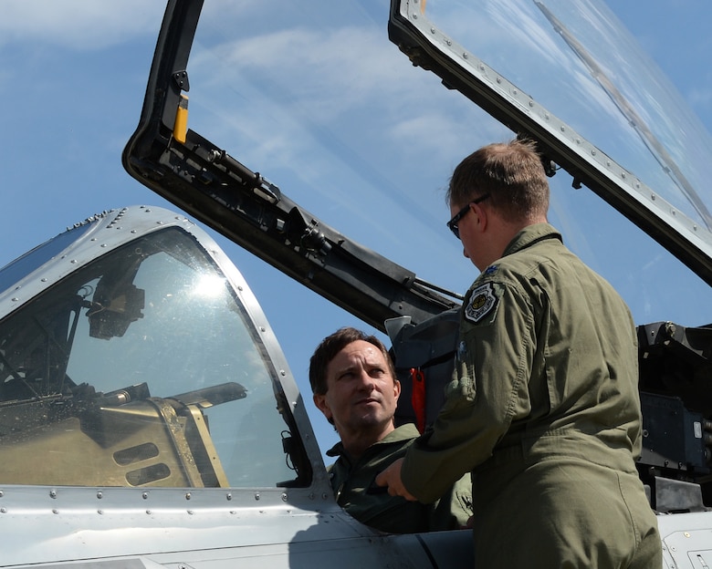 U.S. Air Force Lt. Col. Ryan Hayde, 354th Expeditionary Fighter Squadron commander, right, explains the features of an A-10 Thunderbolt II aircraft assigned to the 354th EFS to Slovakian air force Brig. Gen. Miroslav Korba, Slovakia air force commander during a theater security package deployment at Sliac Air Base, Slovakia, May 18, 2015. The U.S. and Slovakian air forces will conduct training aimed to strengthen interoperability and demonstrate the countries' shared commitment to the security and stability of Europe. (U.S. Air Force photo by Senior Airman Dylan Nuckolls/Released)