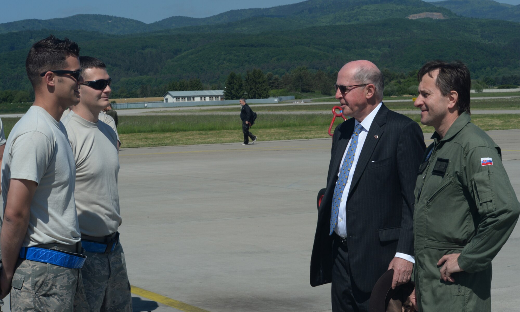 U.S. Air Force Airmen assigned to the 354th Expeditionary Fighter Squadron speak to Theodore Sedgwick, U.S. Ambassador to Slovakia, center right, and Slovakian air force Brig. Gen. Miroslav Korba, Slovakian air force commander, right, during a theater security package deployment at Sliac Air Base, Slovakia, May 18, 2015. As part of the deployment, the U.S. and Slovakian air forces will train together May 18-22 to improve interoperability in allied air operations and multinational close-air-support operations. (U.S. Air Force photo by Senior Airman Dylan Nuckolls/Released)