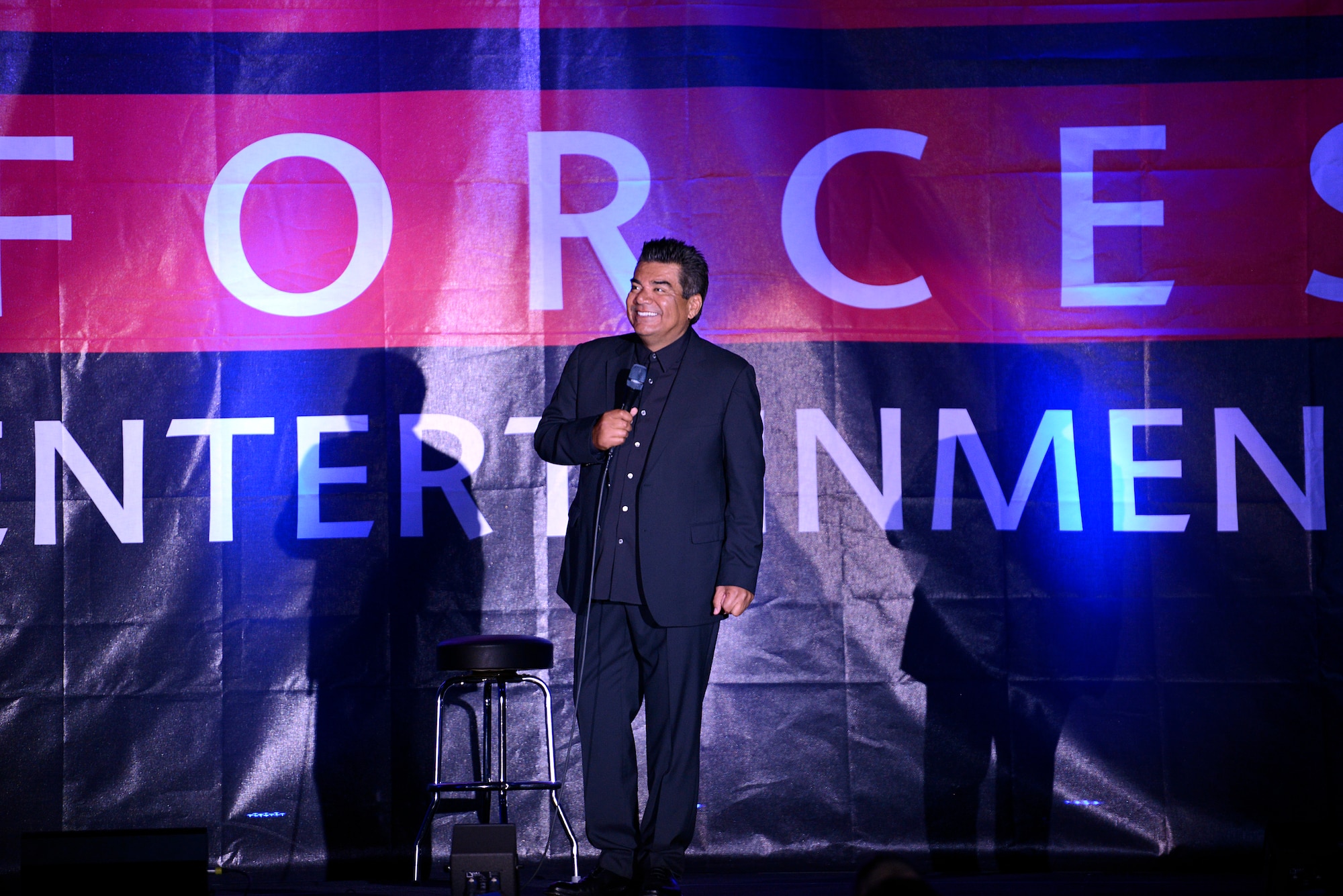George Lopez, a comedian, actor and talk show host, entertains a crowd by performing his comedy routine for an Armed Forces Entertainment event at Ramstein Air Base, Germany, May 16, 2015. The free show was held to provide entertainment to military members and their families. (U.S. Air Force photo/Staff Sgt. Kris Levasseur)