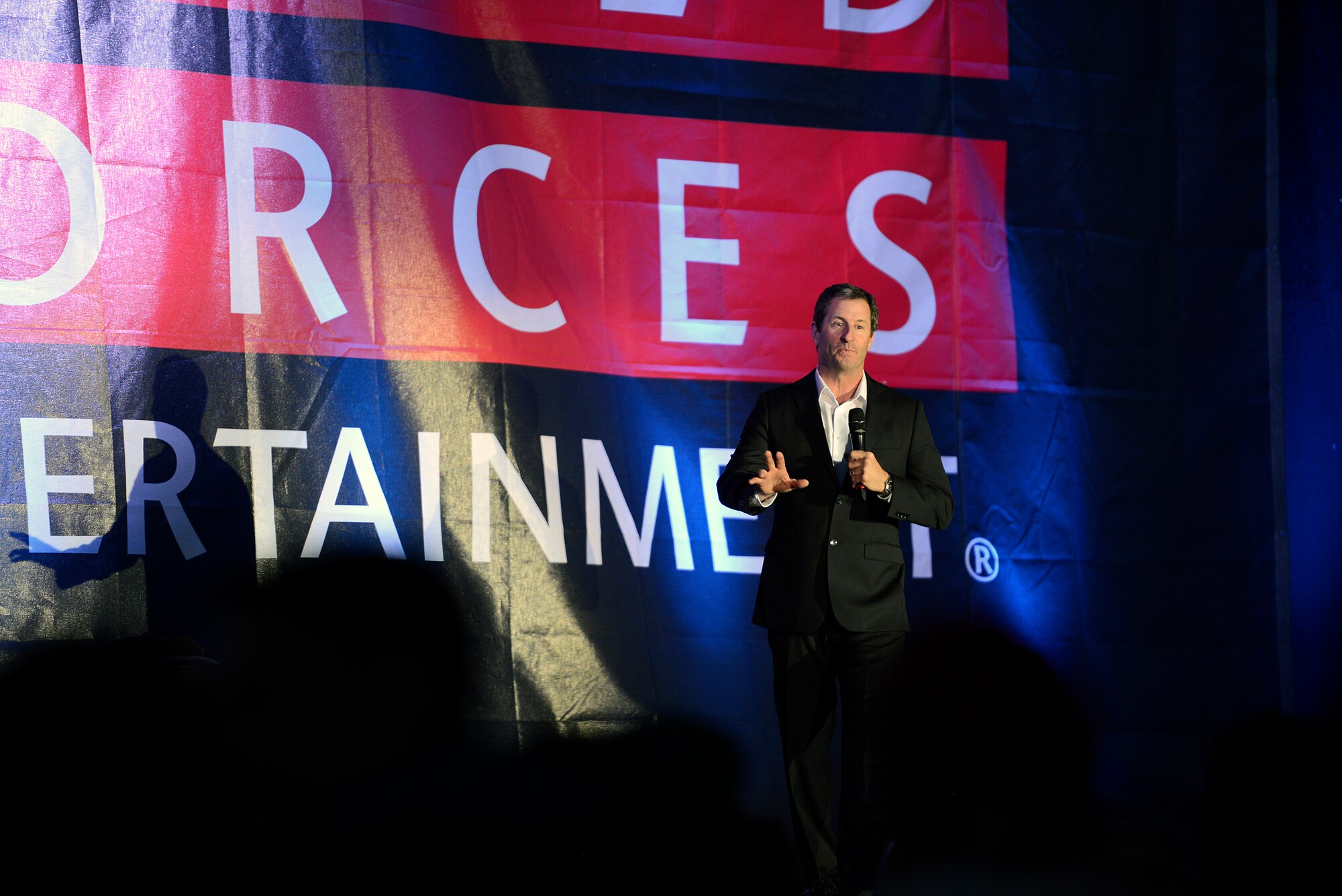 Comedian Bryan Kellen performs his routine during an Armed Forces Entertainment event, featuring George Lopez, at Ramstein Air Base, Germany, May 16, 2015. The show provided free entertainment to military members and their families. (U.S. Air Force photo/Staff Sgt. Kris Levasseur)