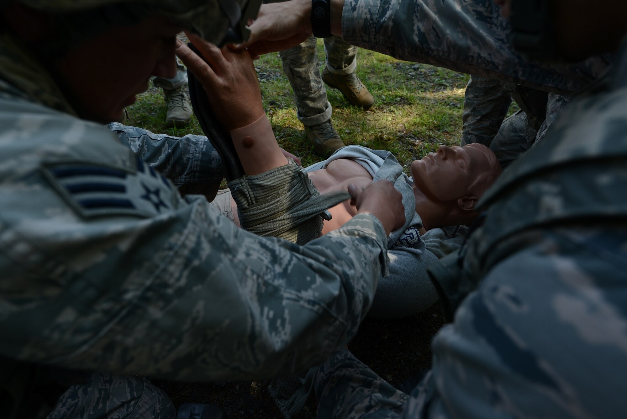 Airmen from the 569th U.S. Forces Police Squadron splint a dummy’s arm for a challenge in the Battle of the Badges competition held in honor of National Police Week May 14, 2015, at Vogelweh Military Complex, Germany. The Airmen had to administer aid to the dummy’s injuries in fewer than four minutes to prevent from being penalized in the competition. (U.S. Air Force photo/Airman 1st Class Tryphena Mayhugh) 