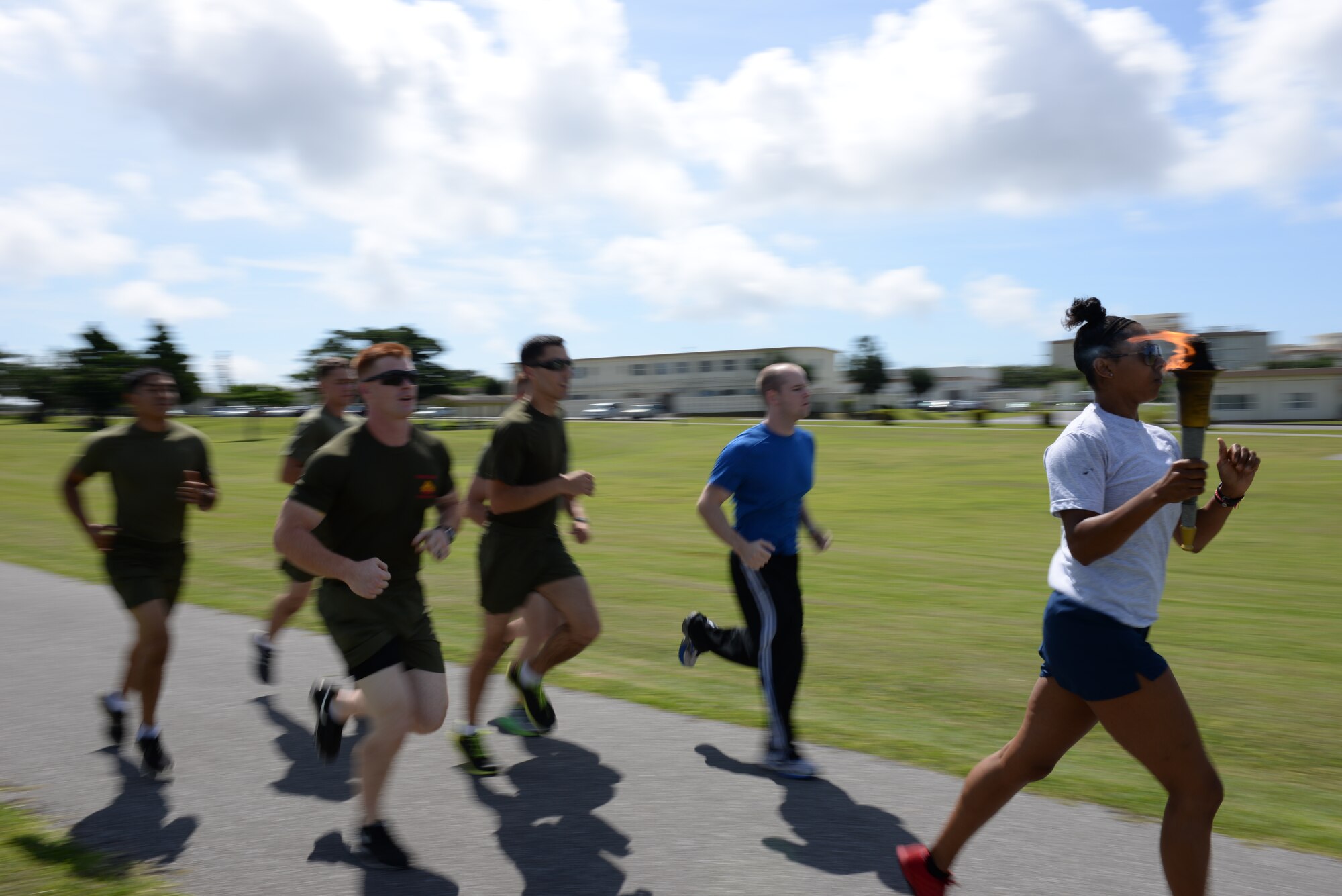 U.S. Air Force Tech. Sgt. Avriel Campbell, 18th Security Forces Squadron flight chief, leads the first lap of the National Police Week 24-hour vigil run at Marek Field Park on Kadena Air Base, Japan, May 14, 2015. National Police Week began in 1962 as a proclamation by President John F. Kennedy to pay recognition to those law enforcement officers who had lost their lives in the line of duty.  (U.S. Air Force photo by Senior Airman Omari Bernard) 
