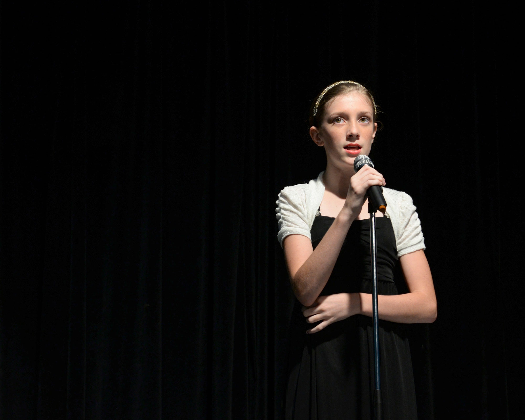 Haylee, contestant, sings during an audition for Operation Talent Search May 7, 2015, at Andersen Air Force Base, Guam. The Operation Talent Search Air Force level overall winner will compete online with the winners from two other talent competitions, Mission Audition and #Vocal Upload, to become the Air Force Entertainer of the Year. (U.S. Air Force photo by Senior Airman Amanda Morris/Released)
