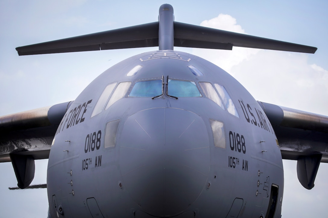 A C-17 Globemaster III aircraft prepares for takeoff during a ...