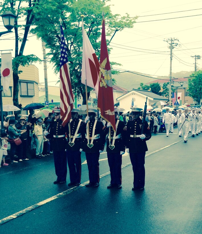The Marines of the CATC Camp Fuji Color Guard proudly bear the National Flags of the U.S. and Japan, as well as the Marine Corps Standard, at the Shimoda Black Ships Festival.