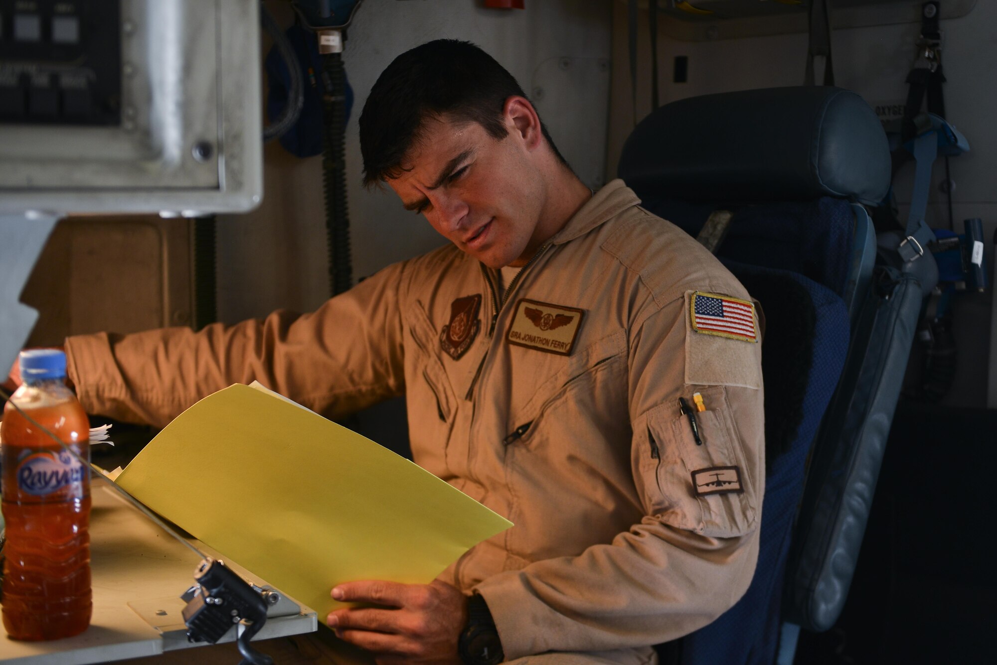 Senior Airman Jonathon Ferry, 816th Expeditionary Airlift Squadron, goes over a preflight manifest of cargo prior to take off on a C-17 Globemaster aircraft May 13, 2015 at Al Udeid Air Base, Qatar. Airmen from separate squadrons deployed to Al Udeid helped support a mission for forward deployed members of RED HORSE Civil Engineering to repair a runway in Southwest Asia in support of Operation Inherent Resolve. (U.S. Air Force photo/Staff Sgt. Alexandre Montes)