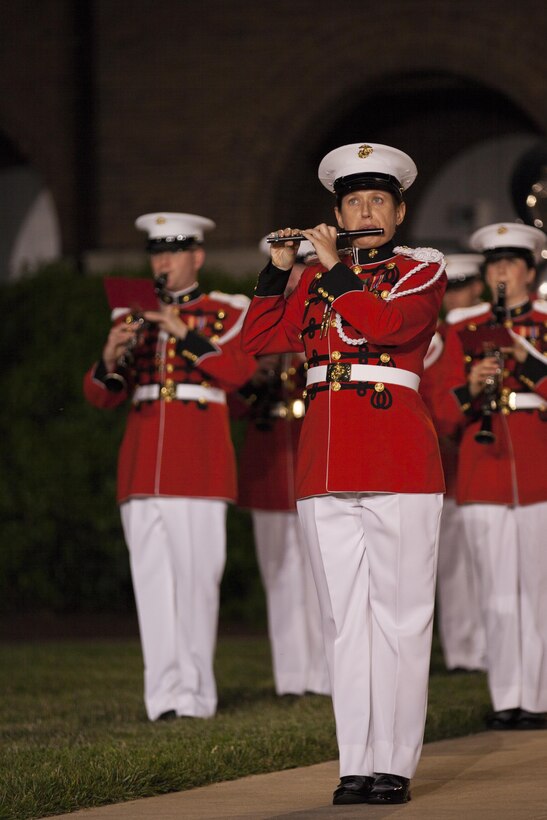 Members of the U.S. Marine Band perform during an evening parade at Marine Barracks Washington, D.C., May 15, 2015. The U.S. Marine Band was founded in 1798 by an act of Congress and plays over 500 performances annually in support of the President of the United States and the Commandant of the Marine Corps. (U.S. Marine Corps photo by Lance Cpl. Alex A. Quiles/ Released)