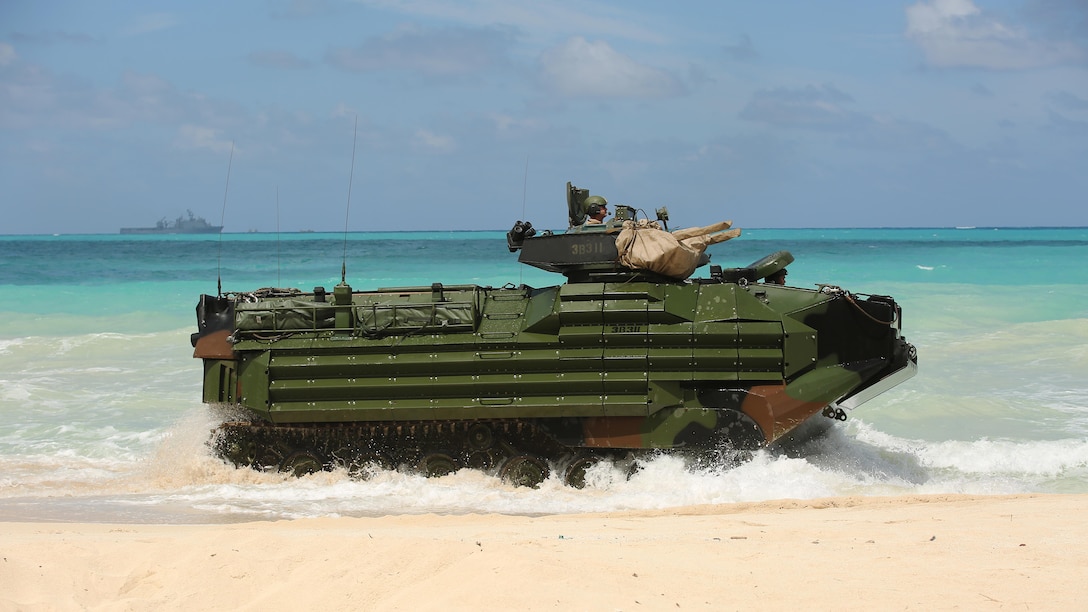 Marines drive an Amphibious Assault Vehicle on the beach of Marine Corps Training Area Bellows, Hawaii during the MARFORPAC-hosted U.S. Pacific Command Amphibious Leaders Symposium May 19, 2015. PALS is designed to bring together senior leaders of allied and partner Marine Corps, naval infantries, and militaries spanning the Indo-Asia-Pacific region with interest in military amphibious capability development. This year, 22 nations sent representatives to observe the training.
