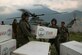 U.S. Marines and Nepalese soldiers unload tarps off of a UH-1Y Huey at Orang, Nepal, during Operation Sahayogi Haat, May 19, 2015. Joint Task Force 505 is drawing down its earthquake relief operations as the Nepalese government and international aid agencies have postured for long-term recovery and reconstruction efforts. Nepal announced its transition from relief operations to the recovery phase of disaster response May 19. (U.S. Marine Corps photo/Cpl. Isaac Ibarra) 