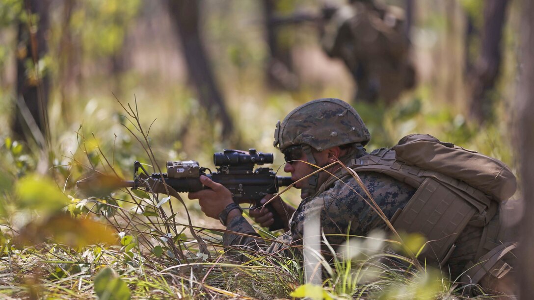 Marines with Company A, 1st Battalion, 4th Marine Regiment, Marine Rotational Force – Darwin, buddy rush during a mock squad attack as part of a live-fire training event May 14 to16 at Kangaroo Flats Training Area, Victoria, Northern Territory, Australia. The Marines and soldiers with 5th Battalion Royal Australian Regiment, Australian Army, Australian Defence Force, brushed up on squad attack tactics, basic point man skills and explosives to refine basic infantry skills. Company A is a part of the Marine Air Ground Task Force that is composed of an air, ground, logistics and command element creating the MRF-D. The rotational deployment in Darwin enables Marines to more effectively train, exercise and operate with their partners, enhancing regional security and building a capacity to respond more rapidly to natural disasters and crises throughout that region.