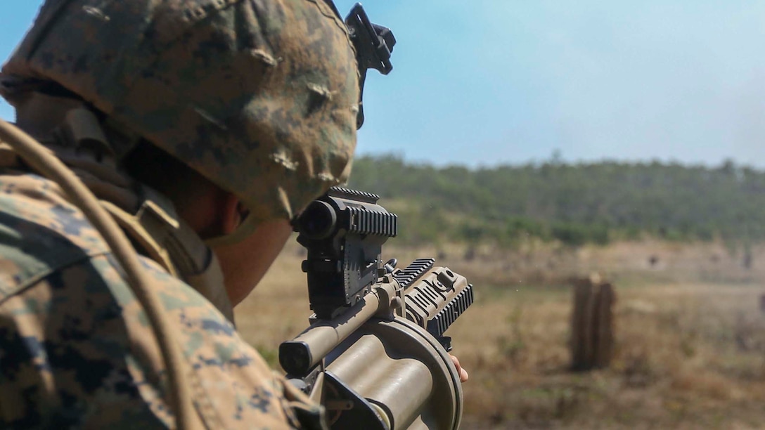 Lance Corporal Brandon Renteria fires simulation rounds from a M32A1 multi-shot grenade launcher during a live-fire training event alongside Australian soldiers with 5th Battalion Royal Australian Regiment, Australian Army, Australian Defence Force, May 15 at Kangaroo Flats Training Area, Victoria, Northern Territory, Australia. The Marines with Company A, 1st Battalion, 4th Marine Regiment, Marine Rotational Force – Darwin, and Australian soldiers brushed up on squad attack tactics, basic point man skills and explosives to refine basic infantry skills. The rotational deployment of U.S. Marines affords an unprecedented combined training opportunity with their Australian allies and improves interoperability between the two forces. Renteria is a rifleman with Company A, 1st Battalion, 4th Marines, MRF-D.