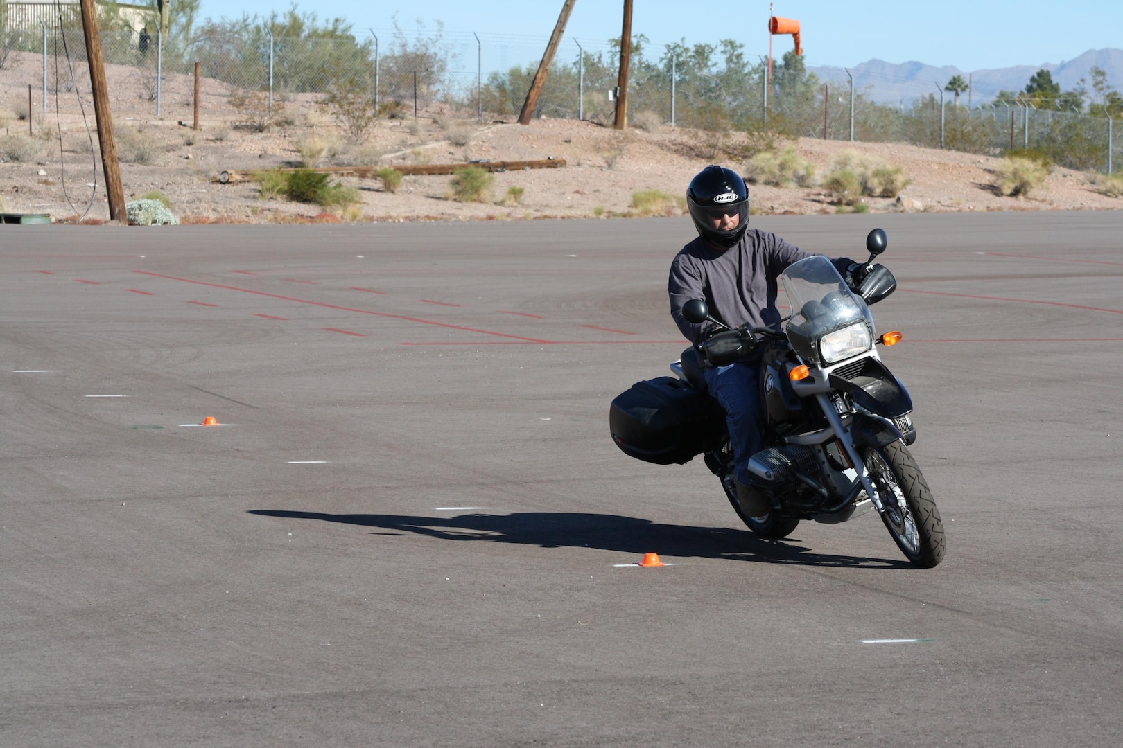 Command Sgt. Maj. Patrick Powers weaves between cones during the Arizona Army National Guard Motorcycle Safety Basic Rider Course at the Papago Park Military Reservation in Phoenix, Dec. 11. There are 10 hours of riding instruction to complete the safety course requirement.