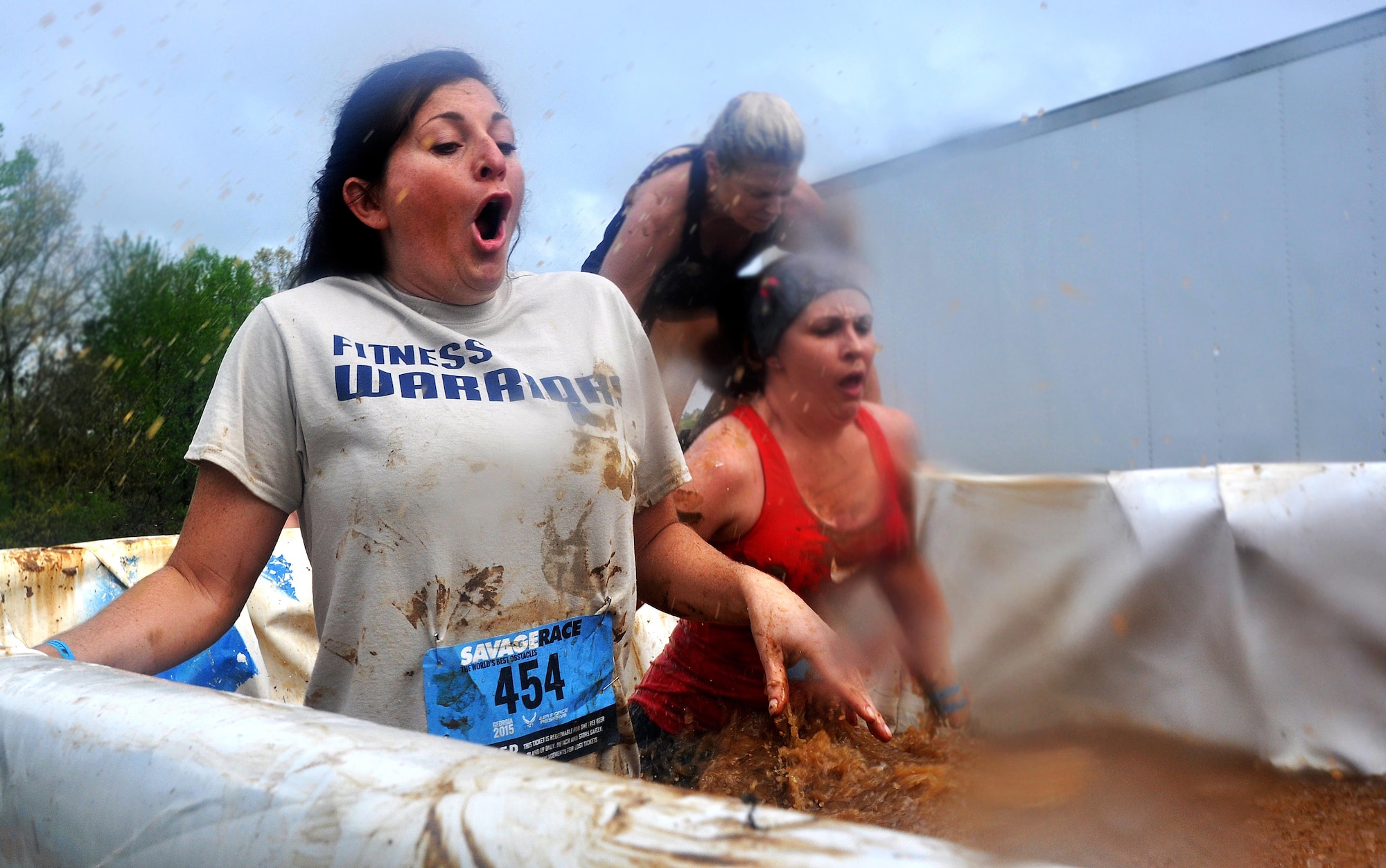 Tech. Sgt. Vicki Brown, 94th Airlift Wing Command Post, wades through a muddy pool of ice water during the Georgia Spring 2015 Savage Race in Dallas, Ga., April 18, 2015. The Savage Race is an Air Force Reserve sponsored obstacle course that challenges participants in more than 20 different trials over the course of five miles. (U.S. Air Force photo/Senior Airman Daniel Phelps)