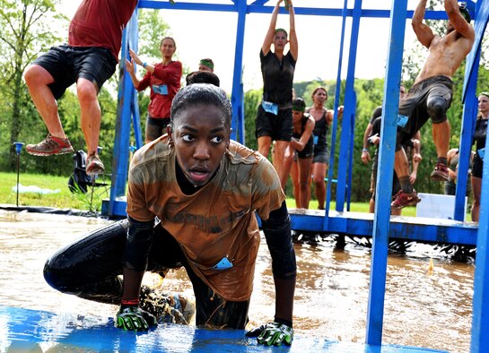 Erica Jones, daughter of Senior Master Sgt. Eric Jones, 94th Logistics Readiness Squadron, climbs out of a pool of water during the Georgia Spring 2015 Savage Race in Dallas, Ga., April 18, 2015. The Savage Race is an Air Force Reserve sponsored obstacle course that challenges participants in more than 20 different trials over the course of five miles. (U.S. Air Force photo/Senior Airman Daniel Phelps)