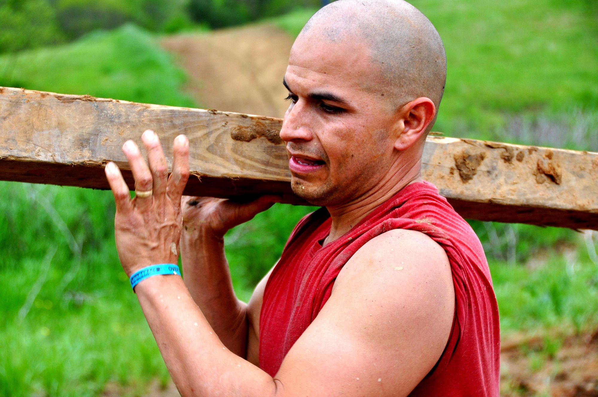 Staff Sgt. Luis Pluguez, 94th Aeromedical Staging Squadron, carries a block of wood during the Georgia Spring 2015 Savage Race in Dallas, Ga., April 18, 2015. The Savage Race is an Air Force Reserve sponsored obstacle course that challenges participants in more than 20 different trials over the course of five miles. (U.S. Air Force photo/Senior Airman Daniel Phelps)