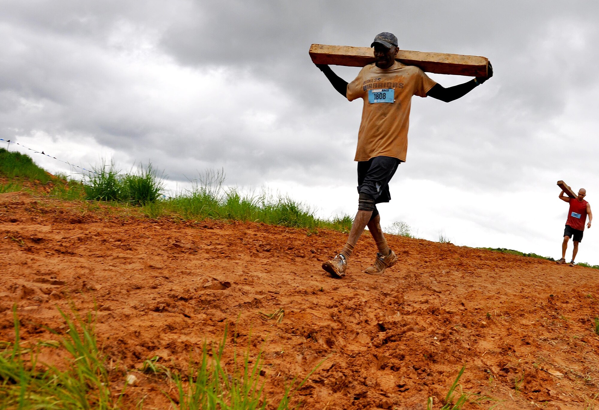 Senior Master Sgt. Eric Jones, 94th Logistics Readiness Squadron, carries a block of wood during the Georgia Spring 2015 Savage Race in Dallas, Ga., April 18, 2015. The Savage Race is an Air Force Reserve sponsored obstacle course that challenges participants in more than 20 different trials over the course of five miles. (U.S. Air Force photo/Senior Airman Daniel Phelps)