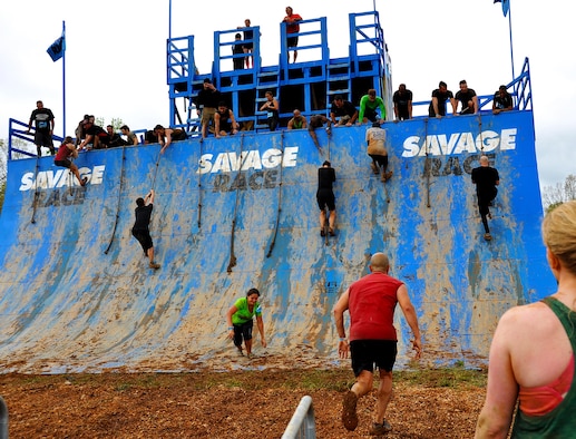 Savage Race participants climb the Colossus during the Georgia Spring 2015 Savage Race in Dallas, Ga., April 18, 2015. The Colossus was a giant 43-foot wall and one of the hardest obstacles in the course. Adding to the difficulty of it being one of the final obstacles, runners had to sprint up the barrier after they’d already sledged through more than four miles in the mud, before grabbing a rope. They would then pull themselves up to the top of the fortification. The Savage Race is an Air Force Reserve sponsored obstacle course that challenges participants in more than 20 different trials over the course of five miles. (U.S. Air Force photo/Senior Airman Daniel Phelps)