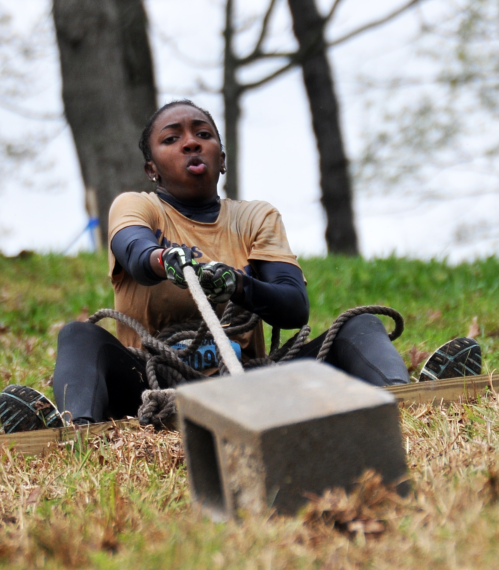 Erica Jones, daughter of Senior Master Sgt. Eric Jones, 94th Logistics Readiness Squadron, pulls a masonry brick up a hill during the Georgia Spring 2015 Savage Race in Dallas, Ga., April 18, 2015. The Savage Race is an Air Force Reserve sponsored obstacle course that challenges participants in more than 20 different trials over the course of five miles. (U.S. Air Force photo/Senior Airman Daniel Phelps)