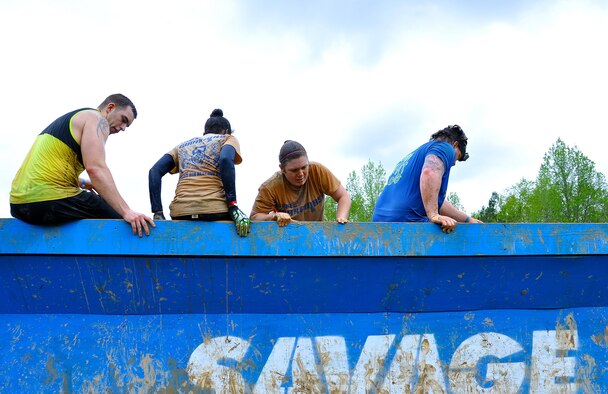 Savage Race participants climb a wall during the Georgia Spring 2015 Savage Race in Dallas, Ga., April 18, 2015. The Savage Race is an Air Force Reserve sponsored obstacle course that challenges participants in more than 20 different trials over the course of five miles. (U.S. Air Force photo/Senior Airman Daniel Phelps)