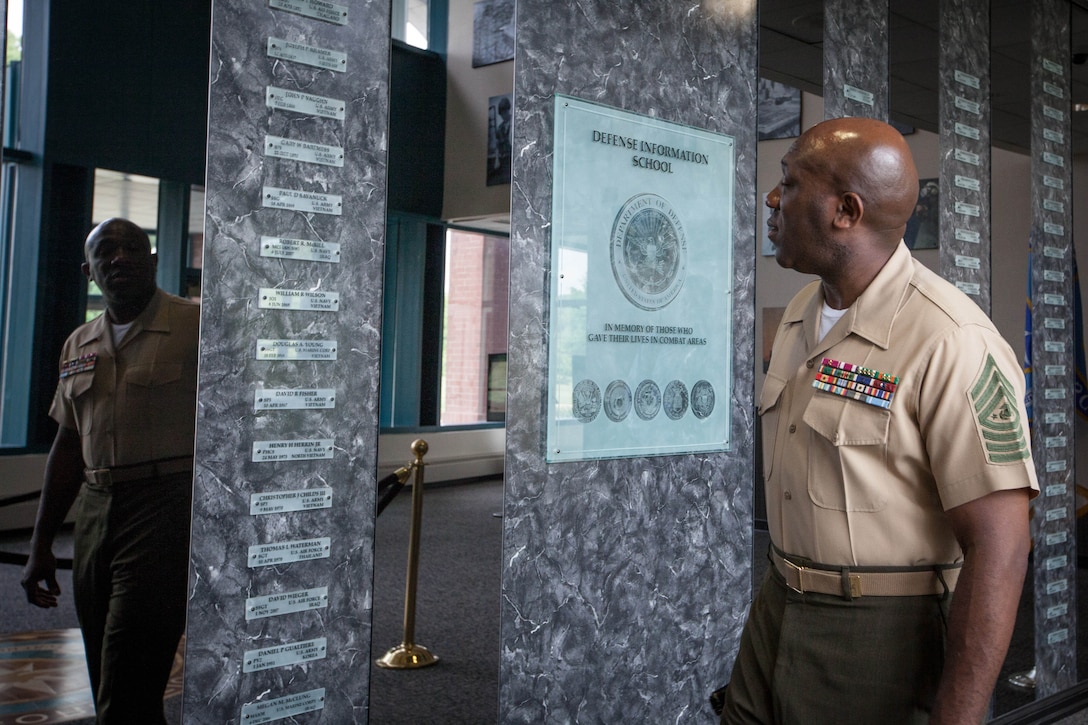 Sgt. Maj. Ronald L. Green, the 18th Sergeant Major of the Marine Corps, visits the Hall of Heroes at the Defense Information School at Ft. George G. Meade, MD., May 19, 2015. The Hall of Heroes honors all members of the visual information communitiy that have lost their lives in the line of duty. (U.S. Marine Corps photo by Sgt. Melissa Marnell)